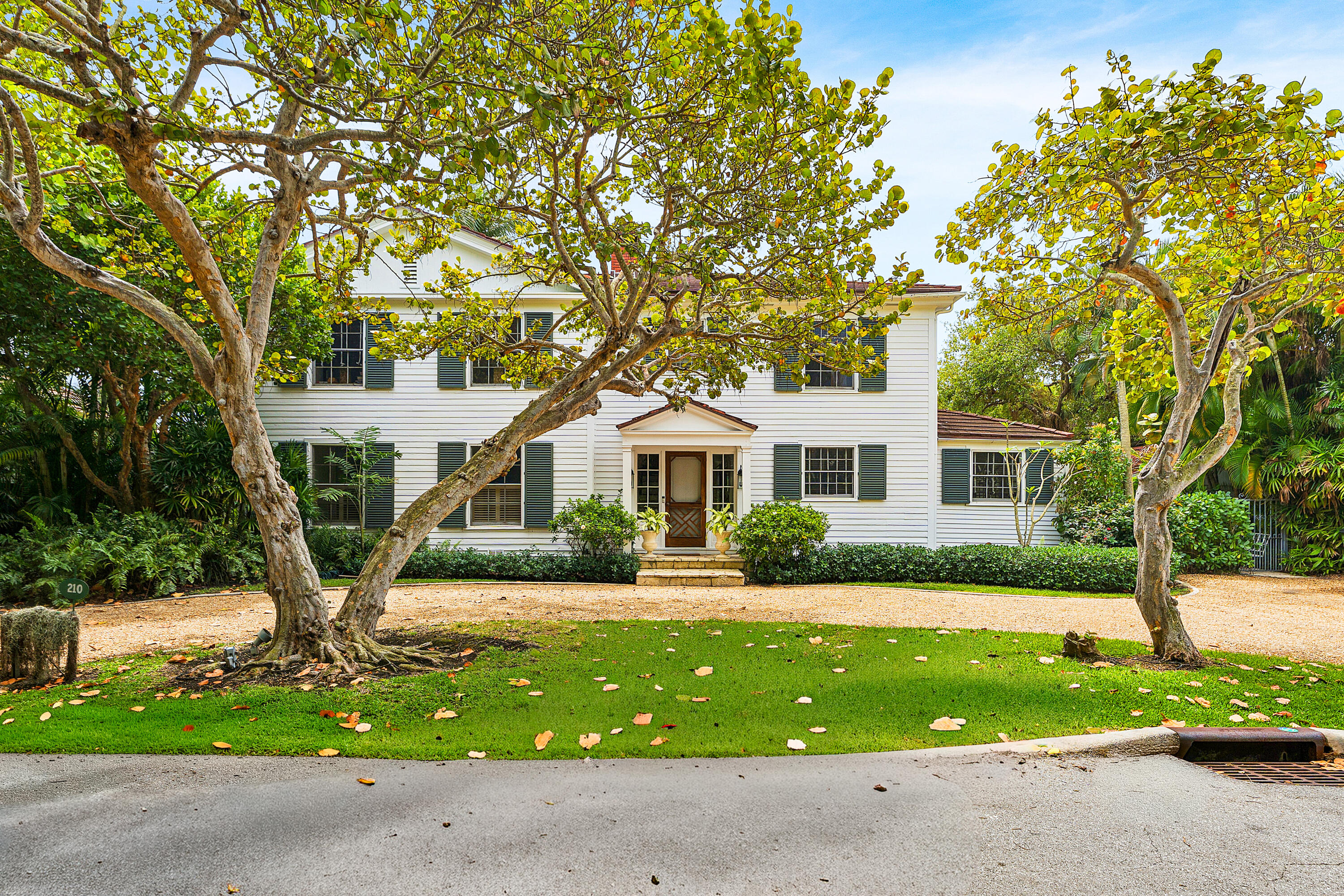An exceptional opportunity in Palm Beach's coveted north end.   Just 3 homes from the Atlantic Ocean.  Set on a prime 100' x 127' lot with private beach access, this rare family compound offers the ultimate blend of location, scale and potential.  The property features a four- bedroom main residence and a separate two-bedroom guest house, creating an ideal setting for hosting, entertaining, or multigenerational living.    Surrounded by lush greenery and offering remarkable privacy, this estate invites endless possibilities - renovate, reimagine, or build a custom ocean-proximate masterpiece in one of Palm Beach's most prestigious and serene neighborhoods.  Properties this close to the ocean, with this level of privacy and flexibility, are increasingly rare - making this a true investment,