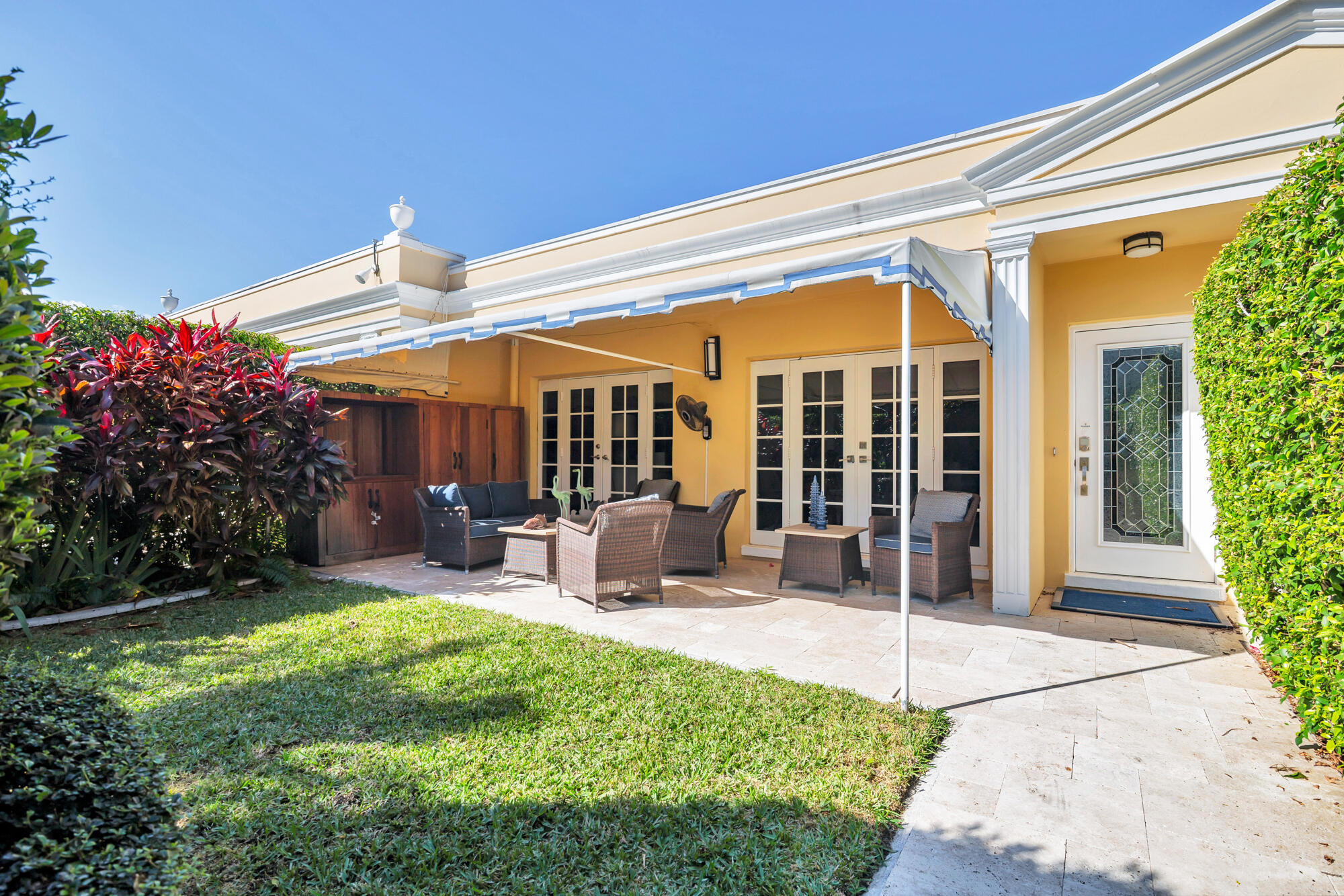 Lovely one-story villa with its own private courtyard lives like a house with a low monthly fee.  A turnkey residence with impact windows and doors.  Bosch appliances, marble floors and bathrooms.  The lushly landscaped garden is private with a covered patio great to enjoy the outdoors and entertaining.  Dedicated off street parking.