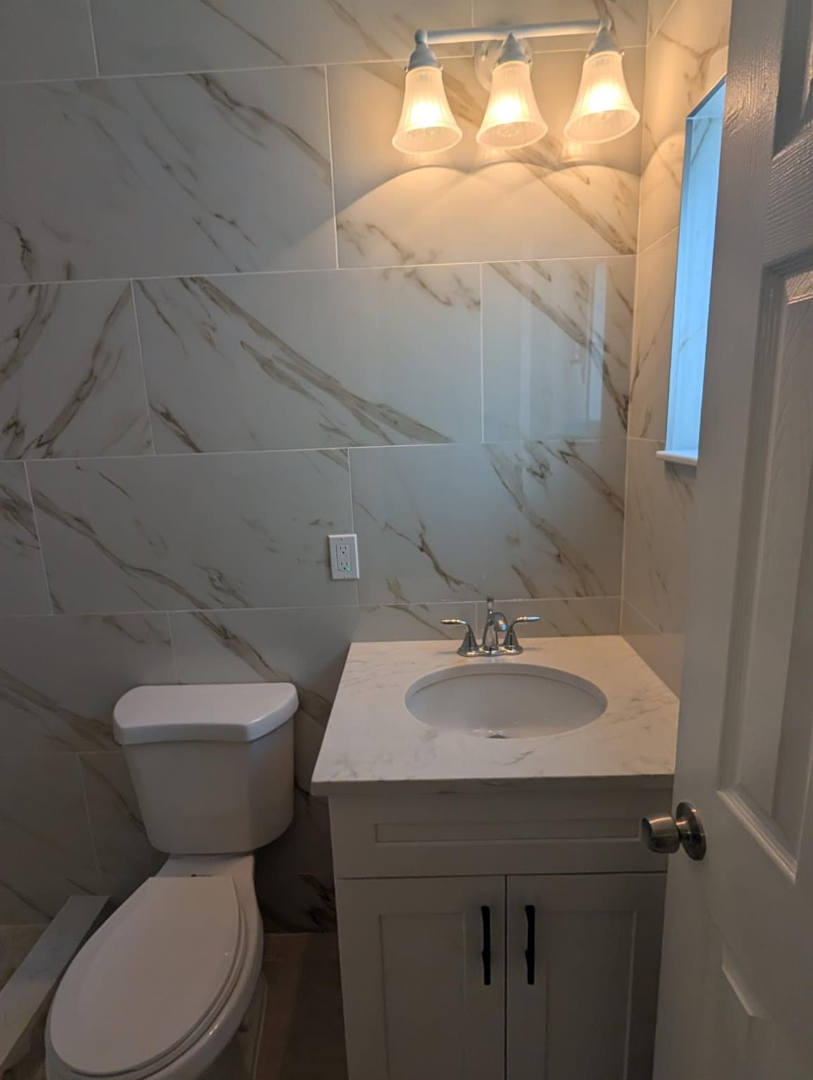 SELLER IS GIVING UP TO $12,000.00 TOWARDS CLOSING COSTS AND PREPAIDS.  Welcome to this beautiful, totally remodeled 3-bedroom, 2-bathroom home featuring a 2-car garage in the heart of North Lauderdale. This residence offers an open floor plan with tile flooring throughout, a large primary bedroom and bathroom, and a spacious kitchen perfect for holiday parties. Outside, you will find a large yard with fruit trees, providing plenty of space for the family. The seller is motivated and ready to sell. Do not miss this opportunity to own a home with ample space both inside and out. ALL APPILANCES EXCEPT FOR WASHER AND DRYER WILL BE INSTALL BEFORE CLOSING.