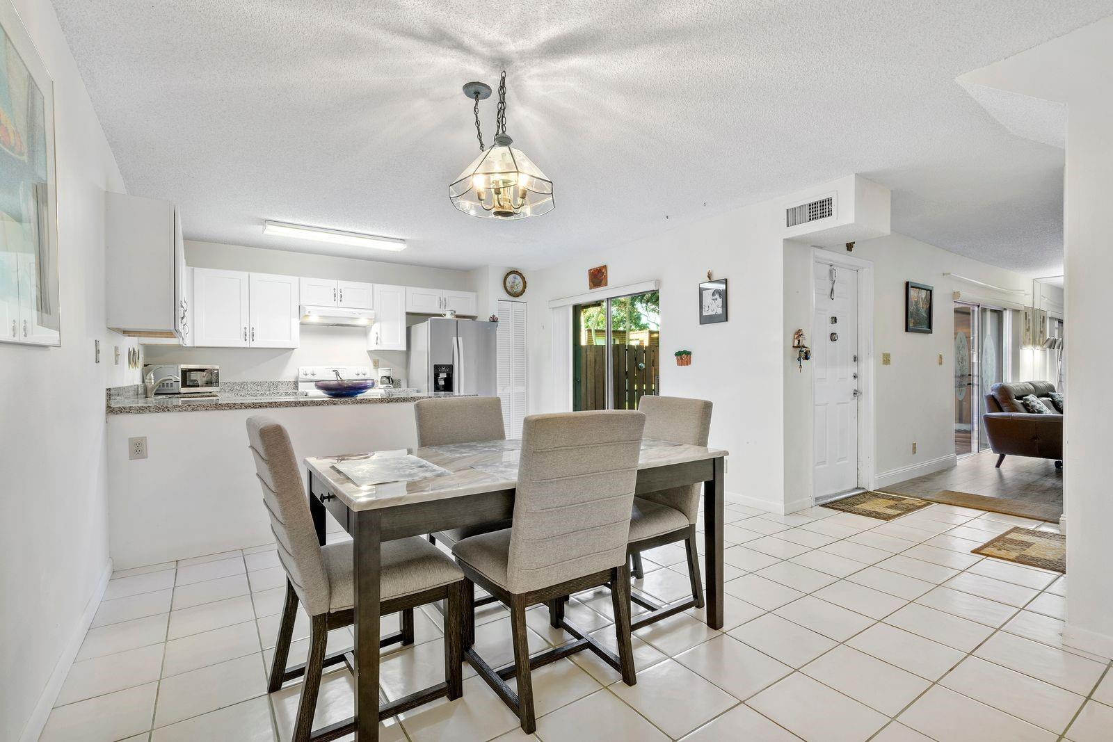Great Deal! Minutes from Nova University, major highways, and shopping. This spacious 2 bed, 2.5 bath townhouse in the desirable Patio Homes of Pine Island Ridge is ideal for investors or end users—rent immediately after purchase! Features include a large owner's suite with walk-in closet, second bedroom with private bath, eat-in kitchen, half bath and laundry downstairs. Excellent opportunity in a prime Davie location! Location, Location, Location! Just minutes from Nova University, major highways, and shopping.