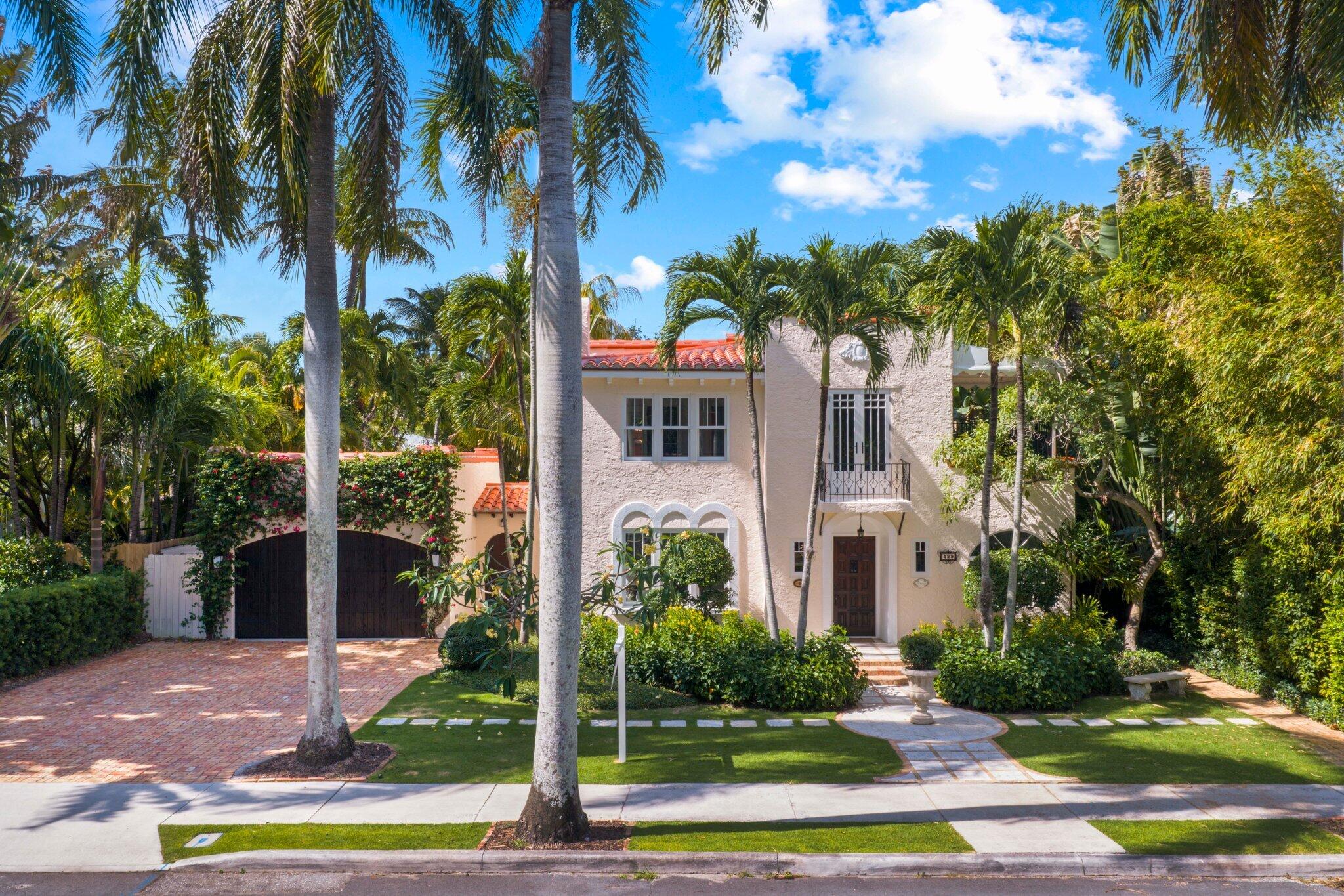 Situated in the heart of Historic Northwood, this stunning 1926 Spanish Mediterranean compound rests on an oversized lot and blends timeless architecture with modern luxury. The two-story main residence provides 3,018 sq. ft. of living space with 4 bedrooms and 3.5 bathrooms, while a fully renovated 727 sq. ft. guest house—complete with its own kitchen, living room, bedroom, bathroom and private gated entrance—offers ideal accommodations for guests, staff, or rental income. Recently renovated throughout, the main home features large open living spaces and abundant natural light anchored by a unique, charming chef's kitchen outfitted with all-new appliances including a gas range. All upstairs bathrooms were fully reimagined with new tile, vanities, fixtures and improved layouts, and a first-floor laundry room and powder room were added for convenience.   The interior finishes include refinished hardwood floors, fresh interior paint and comprehensive electrical, HVAC and plumbing upgrades; all-new Oliveri windows and doors were installed to enhance comfort and style.  The property's original L-shaped orientation thoughtfully faces an uber-chic, private backyard designed for entertaining and relaxing. The grounds showcase a large swimming pool, jacuzzi and Chicago-brick covered vignettes surrounded by mature palm trees, privacy hedges and refreshed landscaping, creating a resort-like setting.   Exterior improvements include a new roof, exterior painting with drywall and stucco repairs, awning replacement and a 2 car garage with an epoxy-coated floor. The guest house received a complete interior and exterior renovation and is fully self-contained with separate utilities and a private entrance.  Additional updates include pool refinishing and upgraded fixtures and finishes throughout. Located close to area beaches, the Flagler Drive bike path, acclaimed dining and Worth Avenue shopping, this meticulously updated Spanish Mediterranean compound melds historic character with turnkey modern comforts—perfect for gracious entertaining, multigenerational living, or a private coastal retreat.