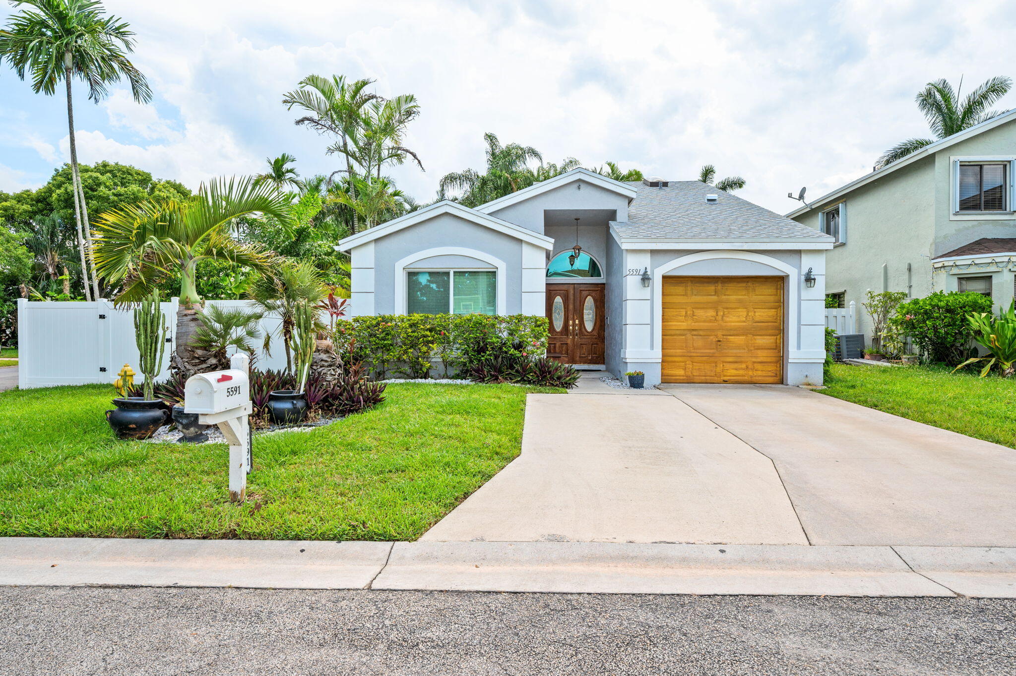 This home is a rare cul-de-sac gem in Cooper City offering three bedrooms, two bathrooms, and the lifestyle families crave. This partially updated home features new flooring throughout, a completely renovated kitchen with quality finishes, impact windows for hurricane protection and energy efficiency - and a brand new roof for lasting peace of mind. The living room floods with  natural light through thee stunning skylights, perfect for working from home or everyday living. But the real magic happens in the back yard, a lush tropical paradise with an inviting pool and hot tub surrounded by mature fruit trees including banana, soursop, pineapple, dragon fruit, cassava, avocado, and papaya, plus beautiful orchid plants and a thriving herb garden.  Fresh fruit and fresh herbs steps from your back door, plus a neighborhood playground right next door makes this ideal for families. A spacious primary suite, no homeowners association, and that coveted cul-de-sac location seal the deal. This is more than a home, it's a complete lifestyle.