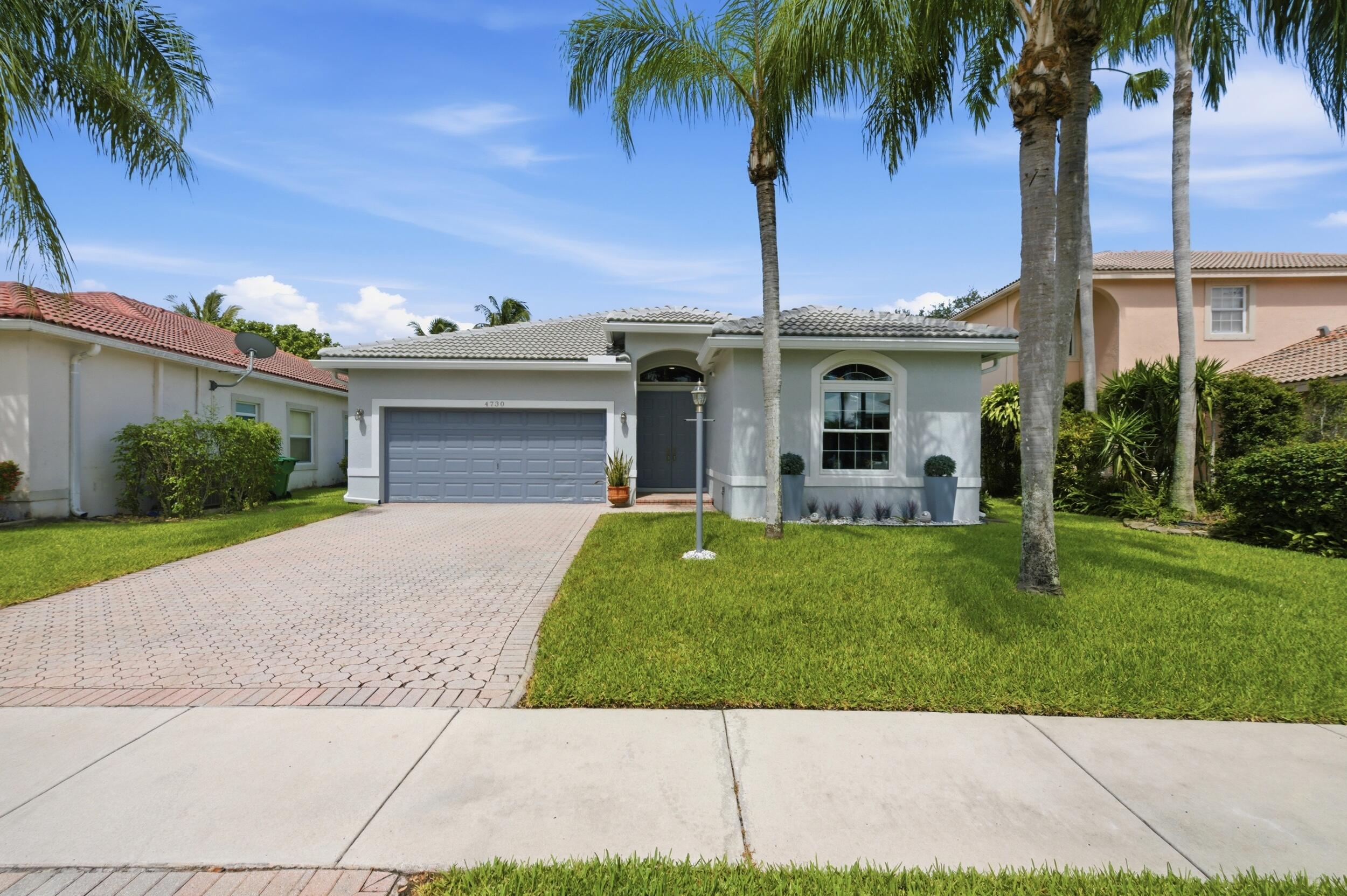 Beautifully updated 4-bed, 2-bath pool home offering the perfect blend of comfort, style, and Florida living! Move-in ready home features a spacious open floor plan. New roof, impact doors and windows, 7" gutters, central A/C and water heater and much more! Updated bathrooms, and generous living areas filled with natural light. The private backyard is an entertainer's dream with a sparkling, heated pool, with colored LED light and plenty of space to relax or host gatherings. Additional highlights include Luxury vinyl plank flooring, 6" wood double stepped baseboards in every room and closet. Freshly painted in and out. 2 car garage. Private fenced-in yard. Gated community. Located in a top-rated school district near shopping, dining, parks, and major highways. Some furniture AI enhanced.