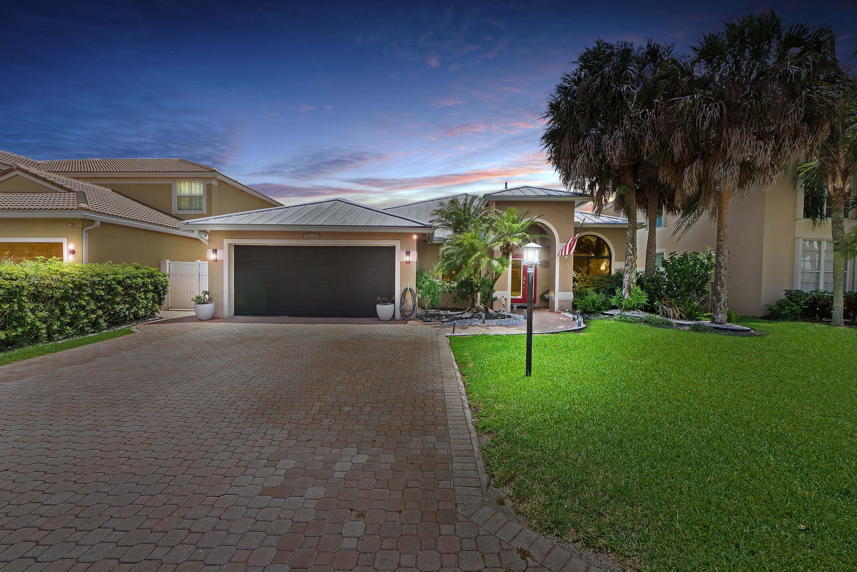 Welcome to this beautifully updated 4-bed, 2.5-bath home in Waters Edge Enclave at Boca Winds. Offering 2,266 sq.ft. of living space, this spacious 1-story home seamlessly blends stylish upgrades with comfortable Florida living. Featuring soaring volume ceilings, neutral tile flooring throughout, modern lighting fixtures, and a split-bedroom floor plan that provides both privacy and functionality. The remodeled kitchen and updated bathrooms make this easy to move into! Inviting indoor spaces flow effortlessly to the outdoor living with your screened pool and patio. Additional features include a new metal roof and impact windows for both peace of mind and energy efficiency. Whole-house water softening system. Heated pool with spa, and the pool can be either salt-water or chlorine...  your choice! Exceptional community amenities, include Town Center, 2 pools, playground, tennis, basketball, and Osprey Point Golf Course nearby!