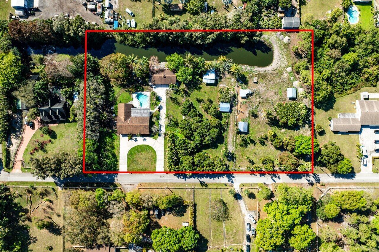 Amazing investment opportunity! Currently leased for $6,000 per month through July 2027, this nearly 4-acre property offers income potential and future development possibilities. The main residence features 4 bedrooms, 2.5 bathrooms, and a 2-car garage, while the detached guest home includes 2 bedrooms, 1 bathroom, and a 1.5-car garage. Enjoy an in-ground pool and a 2-stall barn, all within a Residential Agricultural zoning designation with NO HOA.   The property meets the requirements to be divided into three separate parcels, presenting a unique opportunity for investors, developers, or those seeking multi-generational living. Conveniently located near shopping, dining, and entertainment, and zoned for highly rated schools.  Please do not disturb the tenants.