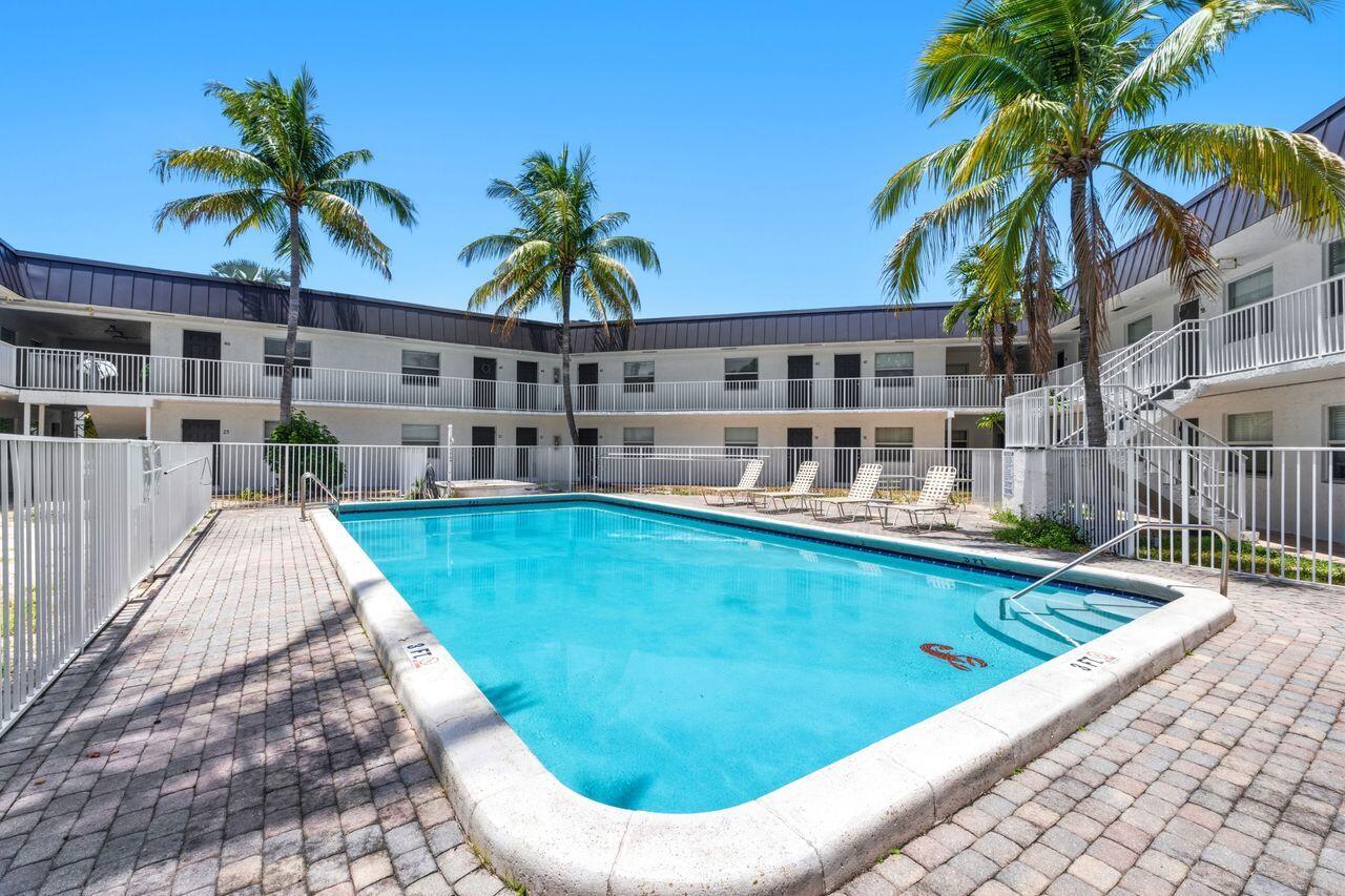 CALLING ALL INVESTORS! Excellent opportunity to own this updated 1-bedroom, 1-bathroom condo in a prime location just minutes from Wilton Manors and a short drive to Fort Lauderdale's beautiful beaches. This move-in-ready unit features impact windows, neutral tile flooring throughout, a brand-new refrigerator and stove, an updated central A/C, electrical panel, and water heater. The spacious bedroom offers abundant natural light, creating a bright and comfortable living space. Wisteria is a pet-friendly community that permits annual rentals, making this an outstanding investment opportunity with the flexibility to rent immediately after closing. The community has successfully completed its milestone inspection and required concrete restoration, and recent improvements include a newer roof,