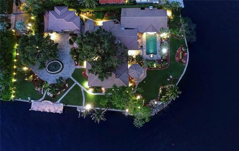 Privately hidden & extremely quiet Point Estate minutes from Las Olas! ONE OF THE LARGEST & VERY BEST PRICED South East point Estates (36,518sf/384'deep water)! Offered close to land value! Superb private resort style Estate with exclusive island compound ambiance close to Las Olas. Amazing views of River, Downtown & surrounding Estates (almost every room).Mainly 1st level living, vaulted ceilings, Chef's kitchen, theatre, wine cellar, club room, 2 bars, 3 fireplaces, gym/office, potential 2 incredible private master wings, large bedroom suites, maid's/captains quarters, impact glass.Spacious guest suite/home office over garage. Gazebo, summer kitchen, superb grounds & pool area-unlike any other point! Totally walled & gated. No bridges or traffic when venturing out from your new home!