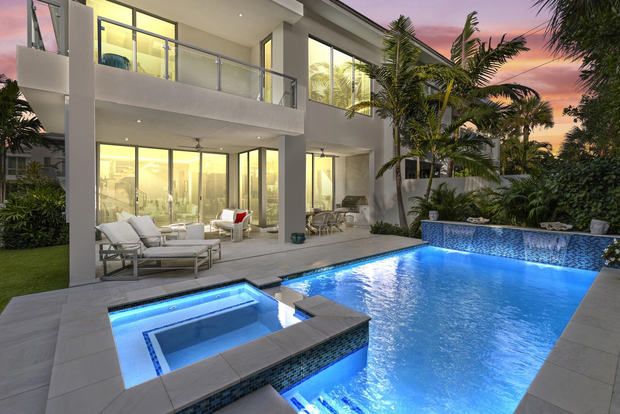 PRIVATE contemporary ultra luxurious residence 400 yards from the sand located in the charming seaside haven of Juno Beach. Boutique enclave. Palm Beach designer added every architectural upgrade. Open floorplan w/5 BD/5 baths/2 car garage, Walls of glass thruout. 10 ft floor to ceiling impact sliders. Steel and glass staircase. Hydraulic elevator. Primary suite boasts outdoor terrace, massive closet, Resort style heated salt water pool/spa w/waterfall. Lush landscaping. Turf grass.  Summer Kitchen Desirable South Exposure. Loft w/wet bar. Chefs open kitchen w/architectural grade cabinetry, Wolf appliances, huge walkin pantry. 10ft Quartz Island. Motorized shades. Expansive 27 ft. rooftop deck w/sweeping ocean views/media area. Smart technology/Security. LOW HOA Walk to dining/shopping