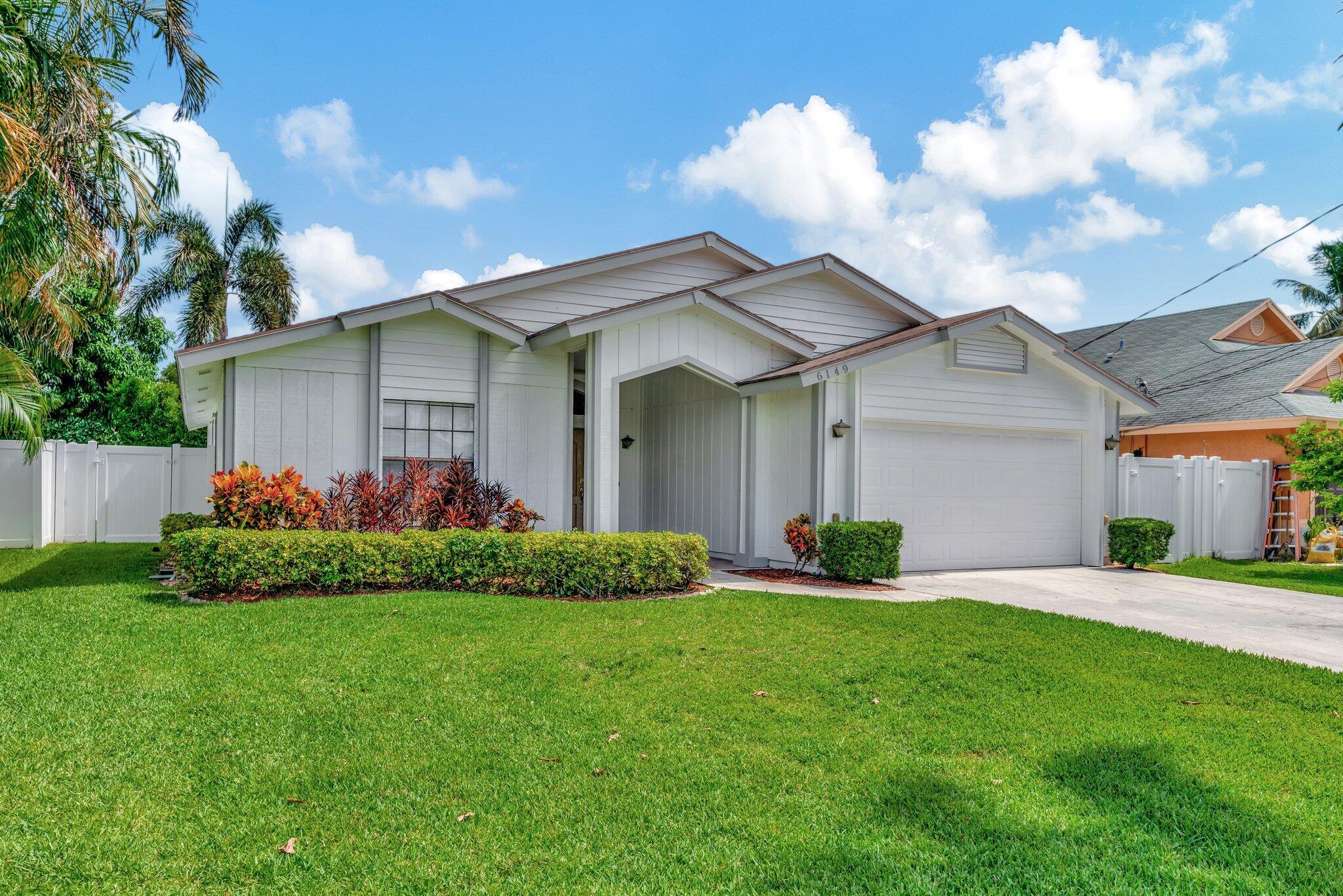 Charming single family home in The Heights in Jupiter! This 3 bedroom, 2 bath, 2 car garage home has a fully fenced backyard, screened patio for relaxing and entertaining and lots of charm. Kitchen features Corian counters and maple cabinetry. Home features laminate and tile flooring, split bedroom plan, and vaulted ceilings in the living room, hurricane protection throughout. Available June 19 as an unfurnished home on an annual basis.  New washer and dryer!
