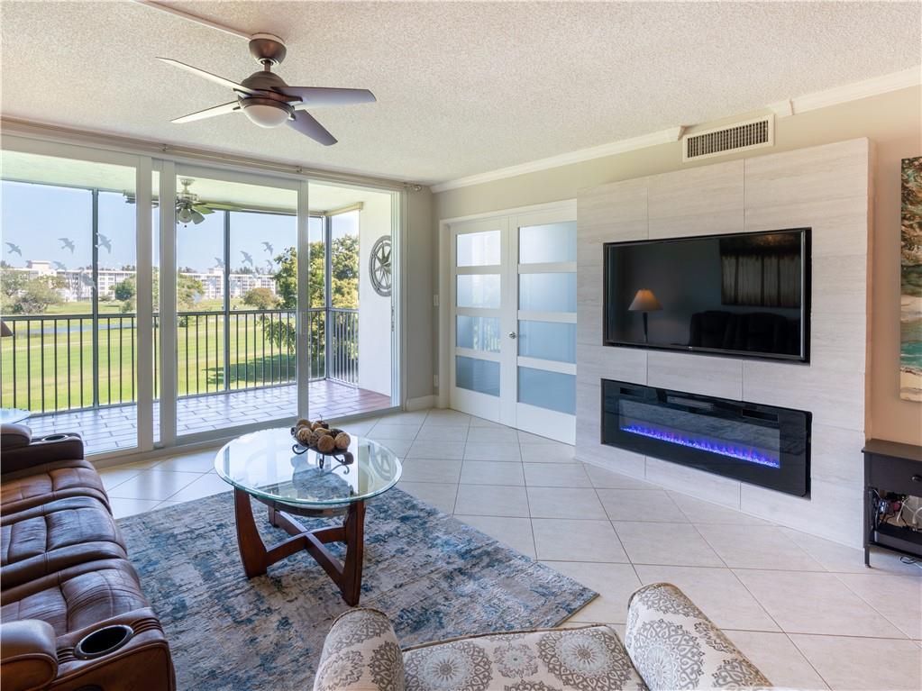 Beautifully Renovated & Turnkey Furnished on the Golf Course of Palm Aire Country Club! This Unit Features 2 bedrooms & 2 full baths, Crown moldings, All impact windows & Sliders, Electric Fireplace, Quartz Counters , Mounted Big screen adjustable bracket to watch TV from multiple angles & rooms, Electric Fireplace, Tastefully furnished, Ceramic Tile Throughout,  Light & Bright, Second bedroom has Murphy bed, All to Enjoy the great South Florida Lifestyle in this Great Golf Course Community! Close to Transit, Restaurants, Shopping & 15 minutes to the Beach! Coming Soon Harrah's New development of Hotel,Residences, Restaurants,TopGolf and a lot more.......