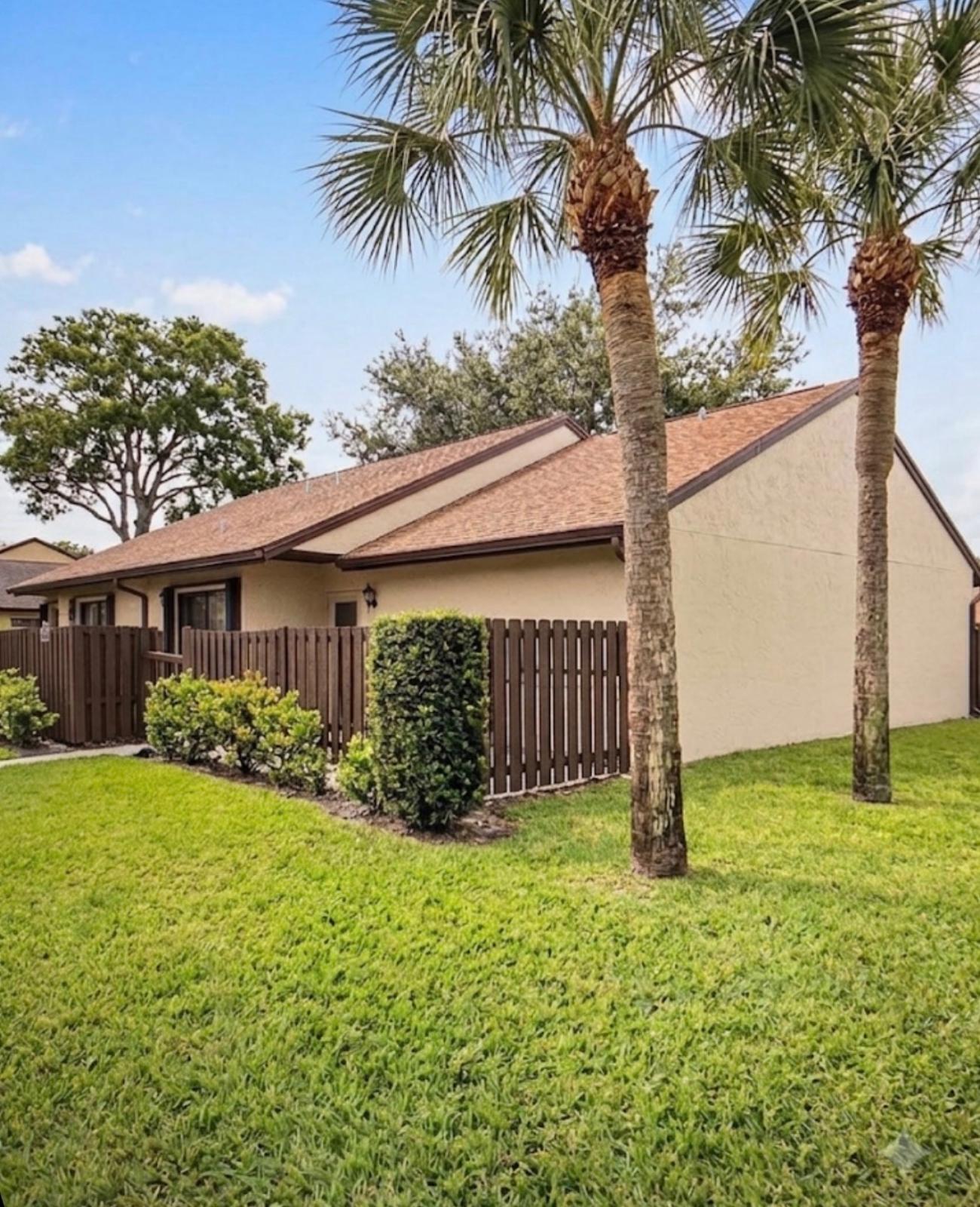 Welcome to this bright and spacious corner unit in the gated Palm Club community. This one-story home features a functional floor plan with an eat-in kitchen, generous living and dining areas, and an enclosed Florida room that adds valuable extra living space.The spacious primary bedroom includes a generous walk-in closet and an updated ensuite bath with a walk-in shower. A comfortable guest bedroom and adjacent full bathroom offer plenty of space for visitors. Step outside and enjoy two secluded patios, ideal for morning coffee or outdoor dining. Enjoy the amenities of Palm Club, including a guarded entrance, community pool, tennis courts, clubhouse, and professional on-site management. Ideally situated near shopping, dining, major highways, the airport, and area beaches.