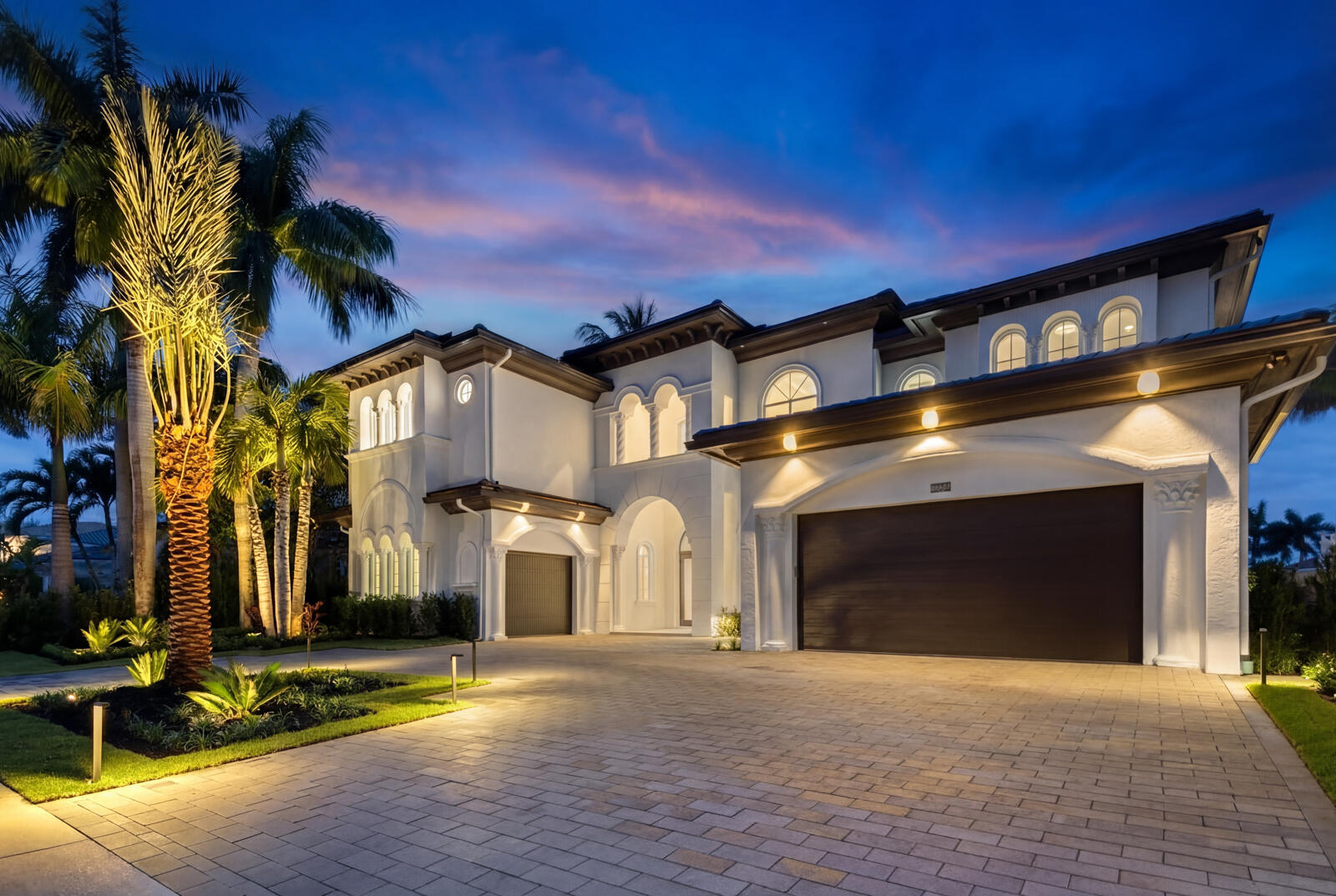 Rarely Available Totally Remodeled Waterfront Estate in the prestigious gated community of Harbour Isles! 5BR, plus office, and a Flex Room that could function as a Game/Media Room or Gym, 5.1 BA, 3 CG CBS home built with the finest, most Luxurious finishes. This Expansive home offers 90' of deep water frontage on a 110' wide canal. Ocean access with no fixed bridges. Abundant living space includes a great room, family room, and upstairs VIP suite with morning bar. Heated Saltwater pool/spa, marble paver decking with gas fire bowl. A gourmet kitchen offers a Wolf 60'' 8 burner Gas stainless steel cooktop with griddle and Wolf double convection oven. Best 60'' chimney style hood, SubZero 60'' fridge/freezer, 2 Cove dishwashers, 30'' Subzero wine cooler - See Supplement for More... 30'' Wolf microwave, 30''Miele built in coffee maker and a walk-in concealed pantry with built-ins. The kitchen features a blend of custom oak hand-made cabinetry and custom white shaker cabinets and and island with Taj Mahal countertops and waterfall edge. This home offers a grand entrance with double impact glass style doors and beautiful staircase with glass railing. The downstairs and upstairs living areas are finished with high quality European White Oak solid wood flooring. Living area features a custom built in wall unit with an 85' LG TV. There are large windows in all the rooms facing the water letting in abundant natural light and providing for a beautiful view of the pool, the water and your boat. The house is perfect for entertaining with a wonderful flow from the indoors to the outdoors. The master suite includes oversized his and her walk-in closets, a spacious bathroom with dual shower and freestanding soaking tub, laundry room and large morning bar, all finished with the highest quality taj mahal countertops.  All additional upstairs bedrooms are ensuite with large bathrooms and walk-in closets.  Outdoor living area features a large covered veranda with cabana bath and summer kitchen complete with built-in gas grill, sink and refrigerator. This home is architect designed with many contemporary features and includes new lush tropical landscaping and hardscape. Additional features include ES high impact hurricane windows and doors, Phillip Jeffries wall coverings. 2 Navien On Demand gas hot water heaters, upstairs and downstairs laundry rooms and a large wet bar with ice maker, wine cooler and a 500 bottle wine display. Three car garage has 15' ceilings to allow for car lifts to be installed and is plumbed and ready for an ice machine. Home is wired for smart technology and has a complete generator with transfer switches installed.