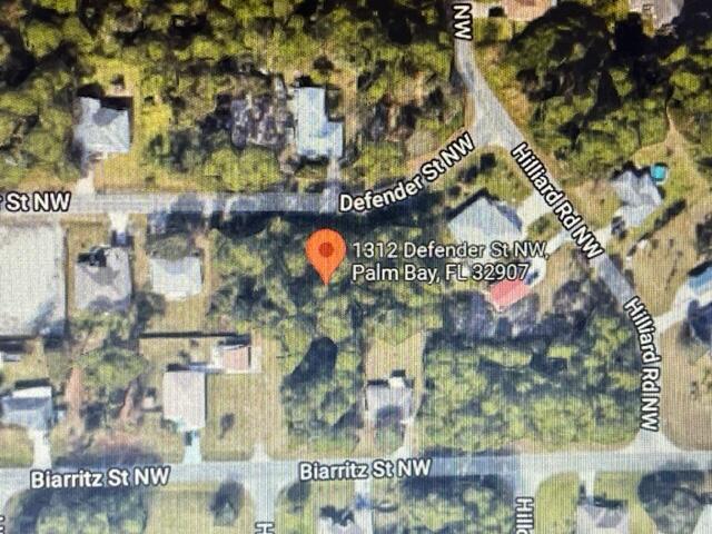 Rare opportunity to own 1/2 acre double lot. This lot to be sold along with 1312 SW Defender as one transaction. Located near St. Johns Parkway just north of Malabar road.