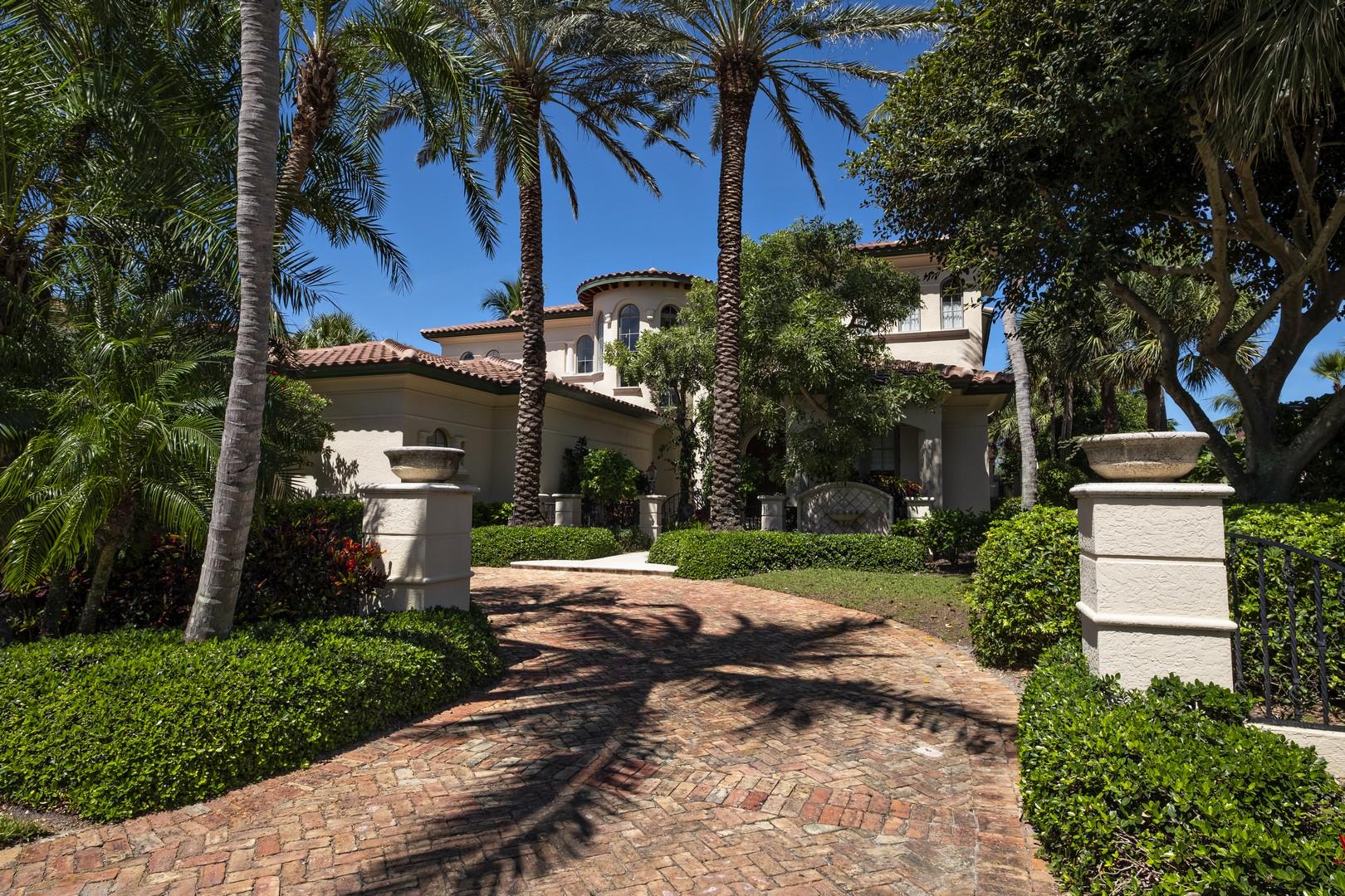 Bold architectural & refined design details give this harbor front estate European flair. Formal living & dining rooms include cove ceilings, Venetian plaster treatment, gas fireplace, arched niches & windows, French doors opening to harbor views. Chefs will value the eat-in kitchen with Dacor 6-burner gas stove with double oven & warming drawer, Sub-Zero refrigerator, 2 KitchenAid dishwashers, center-island with vegetable sink & granite counters. The European style master bath wrapped in marble includes spa tub, separate step-down shower, his/hers vanities & water closets. 3 ensuite guest bedrooms complete the accommodations. Outdoor features include Summer kitchen, cabana bath, double slip dock to accommodate large vessel & smaller craft.