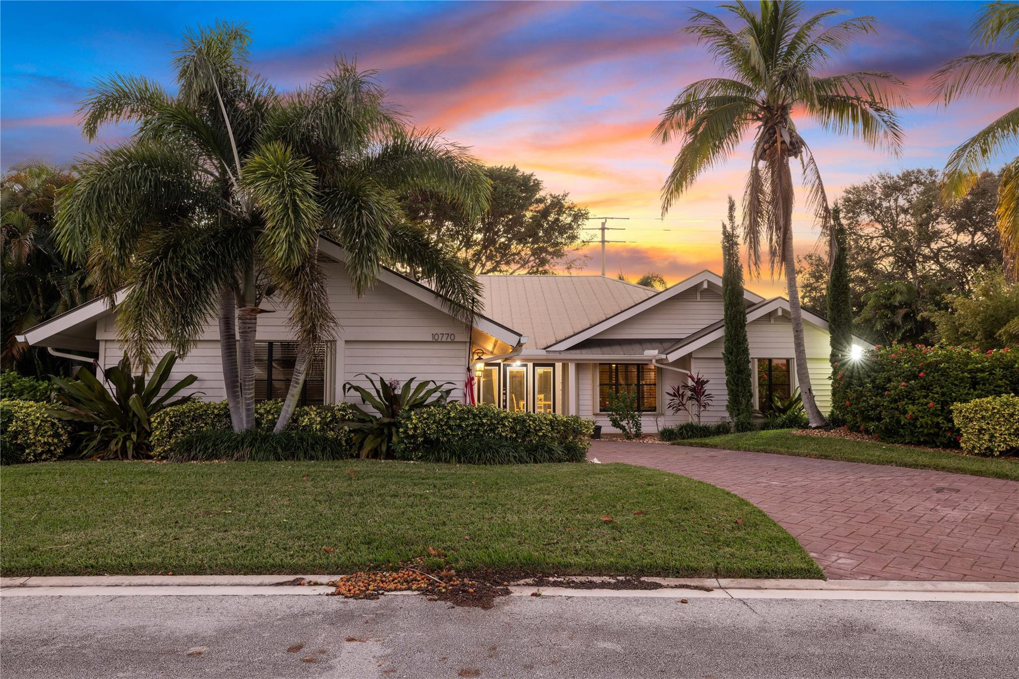 Jupiter Narrows presents this 3 bedroom 2 bath spectacular pool home. Your back yard has been transformed into the perfect tropical escape. Mature trees, bistro lights and a sun deck surround the pool with plenty of room for parties or pets/children. Your main home offers vaulted ceilings the moment you enter, with a large living/dining area. Split bedroom plan with a bonus office. The main suite has a large updated bathroom with his and her sinks/ led lit mirrors and a walk-in closet with built-in's that will not disappoint. Enjoy the sunlight beaming in from the master bedroom reading nook an added bonus. Centrally located, this low HOA neighborhood of Jupiter Narrows is close to the most beautiful beaches. Shopping and dinning near by too!