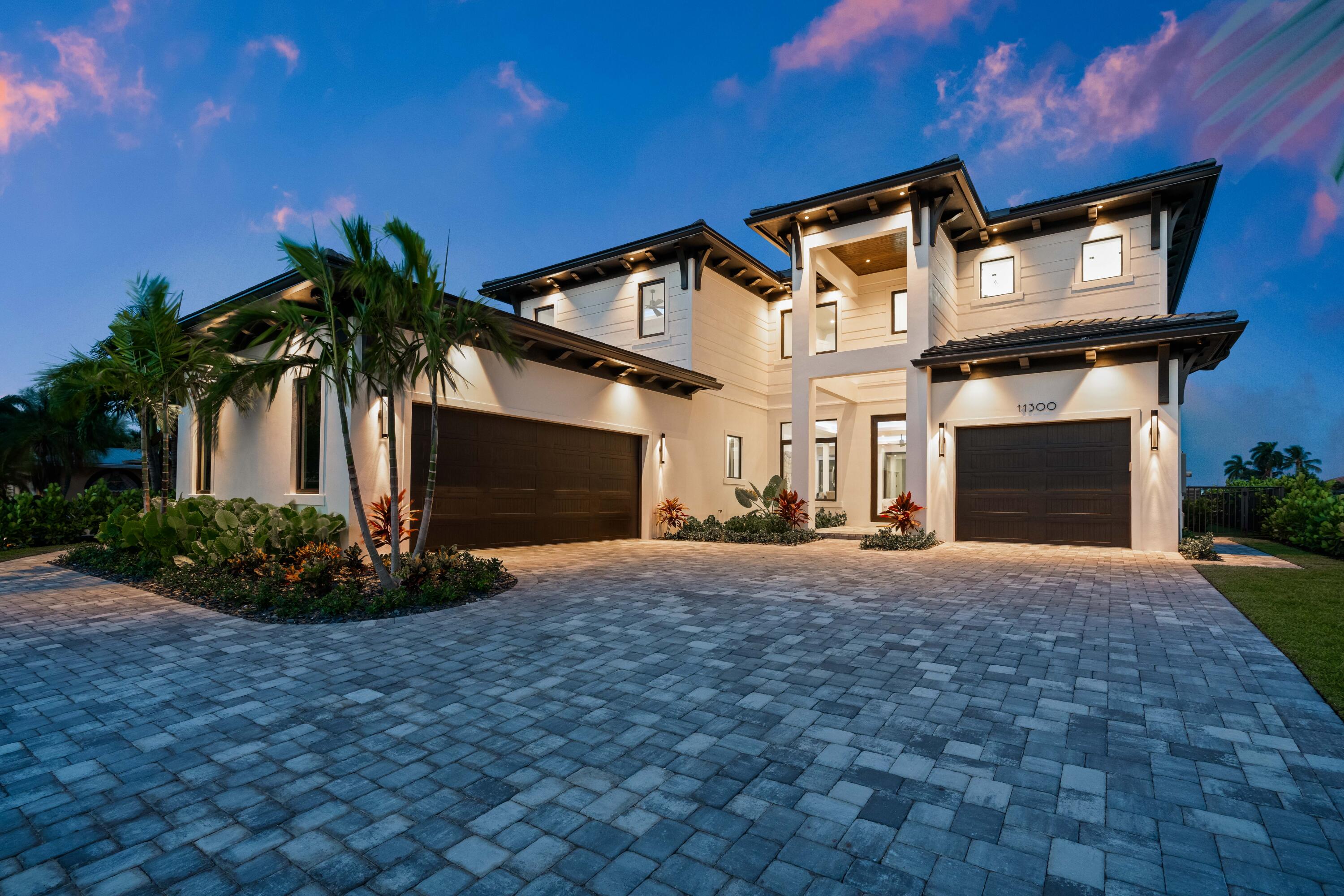 Enjoy sophisticated waterfront living in this brand-new home in this hidden slice of paradise!  This spectacular home located in the private enclave of Pirates Cove offers a flexible floorplan with 5 spacious bedrooms plus loft, and 5.5 baths.  The stunning backyard offers an outdoor kitchen, inviting infinity edge pool, and gorgeous intracoastal views.  The first floor living area includes a large living room with fireplace, dining room overlooking the water, and a chef's kitchen with two islands, Thermador appliances including a dual-fuel range, wine cooler, and walk-in pantry. Other features include impact glass throughout, elevator, electric shades, 1000-gallon propane tank, tankless water heaters, three car garage, and app-controlled automated pool and Sonos sound capability. Minutes to world class shopping, beaches and great restaurants!