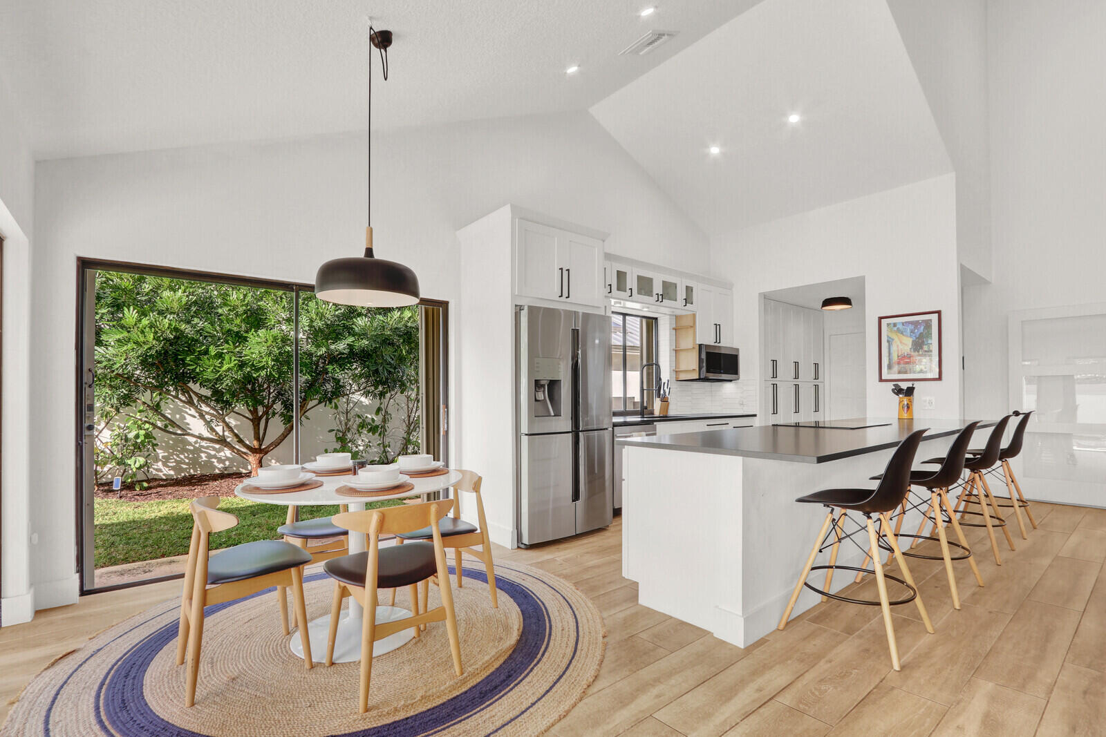 Coastal living awaits just minutes from the iconic Juno Pier and dog beach. This tropical retreat is perched on the highest residential elevation in South Florida, allowing for refreshing ocean breezes. The light and bright open floor plan features soaring ceilings and beach-inspired wood plank tile throughout.  The fully remodeled kitchen serves as the heart of the home and is ideal for entertaining after a day of enjoying the blue Atlantic waters. A dedicated home office and additional loft provide flexible living space that's perfect for working remotely or a cozy retreat. The primary suite offers a tranquil escape, complete with a spa-like bathroom and customizable open-concept closet. Finally, you can also enjoy community amenities including pool, tennis, pickleball, and basketball.