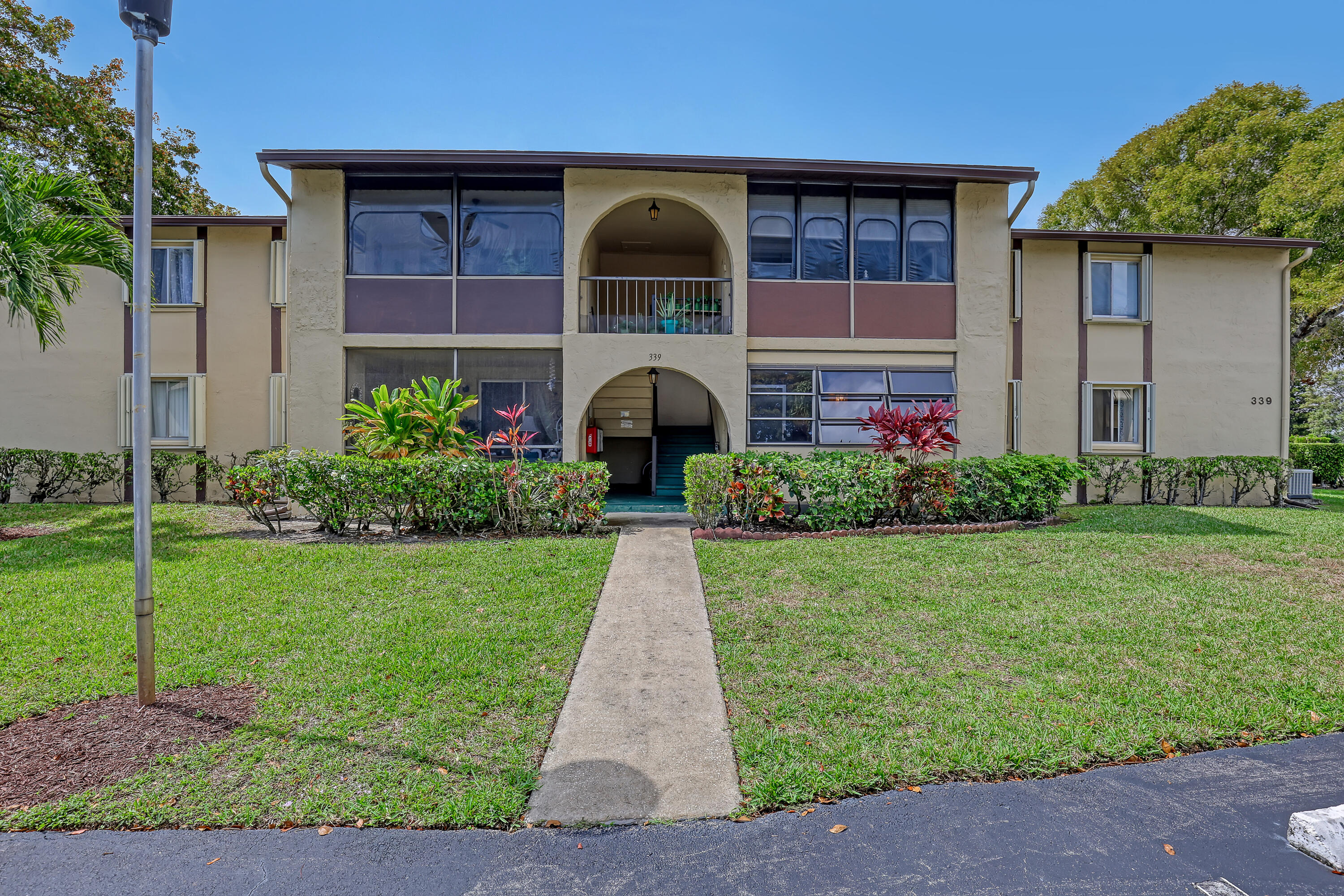 Move right into this updated & fully furnished 2-bedroom, 1.5-bath 1st floor condo in Pine Ridge III, an active 55+ community with affordable monthly fees. Enjoy resort-style amenities including tennis, pickleball, shuffleboard, bocce ball, a clubhouse with library, and seasonal social events hosted by the Men's & Women's Clubs. Your assigned parking space is conveniently located just outside the entrance, with ample guest parking and a community car wash area nearby. Ideally located near world-class shopping, golf courses, beaches, cultural attractions, medical facilities, and Palm Beach International Airport. All furnishings are included, making this truly move-in ready.