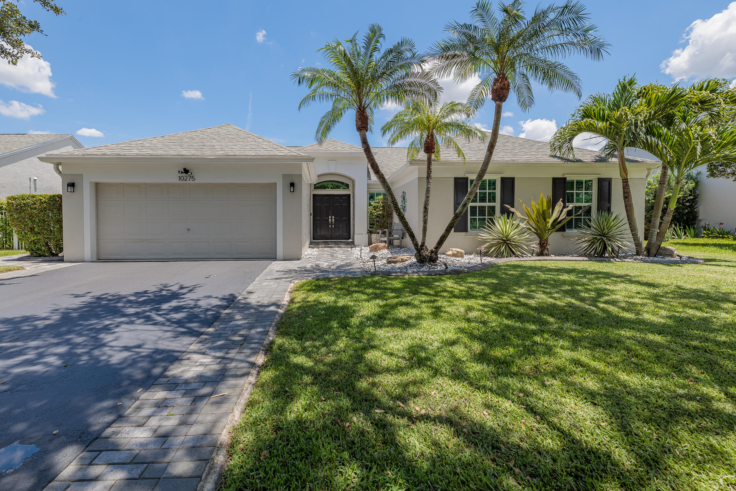 Step into this immaculate, model-like 3BR/2BA home with a den & 2-car garage in the highly desirable Coopers Grove community! This beautifully maintained residence features vaulted ceilings, porcelain wood-look tile flooring throughout & a versatile flex room perfect for a home office or playroom. The renovated kitchen boasts granite countertops, Jarlin espresso soft-close cabinetry & stainless steel LG appliances. Major updates include impact windows (2022), water heater (2018) & roof being replaced prior to closing. Enjoy the screened, covered patio overlooking the fenced backyard w/ privacy hedges & canal views. Epoxy garage floor, freshly coated driveway & a family-friendly neighborhood complete this move-in ready home. Lime Tree, Calamansi/Calamondin Tree & garage fridge do not convey
