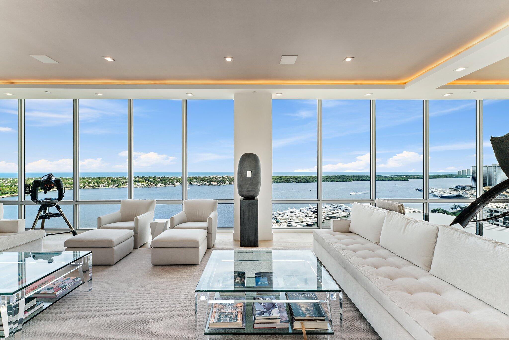 This amazing penthouse suite occupies the entire top floor of Building # 3 at Water Club in North Palm Beach. Enjoy breathtaking views from the Great Room where the East wall is a 42-foot-long by 11-foot-tall wall of glass overlooking the Atlantic Ocean and Lost Tree Village like a postcard. Designed by the owner with the developer prior to construction, this signature property is 1 of 1 with 360-degree views and next level finishes not seen at Water Club. Reading more like an ultra-luxury home in the sky than a condominium, this suite has a great room/kitchen area that would rival the finest area single-family homes. The wood paneled library is a dream workspace with room for a conference table, desk area, reading area, and expansive bookshelves, plus a full private bath. A private gym with half bath, den, guest suite, her office with walk-in closet and bath, powder room, laundry, and two elevator foyers round out the space. Best of all, this penthouse has four assigned parking spaces under the building.  Water Club has world class amenities like 24/7 manned and gated security, private elevator lobbies, underground parking, two private clubhouses with bar and billiards table, resort style pools, day dock, lap pool, two fitness centers, with yoga/pilates studio, spa, fire pits, pickleball court, guest suites, and more.