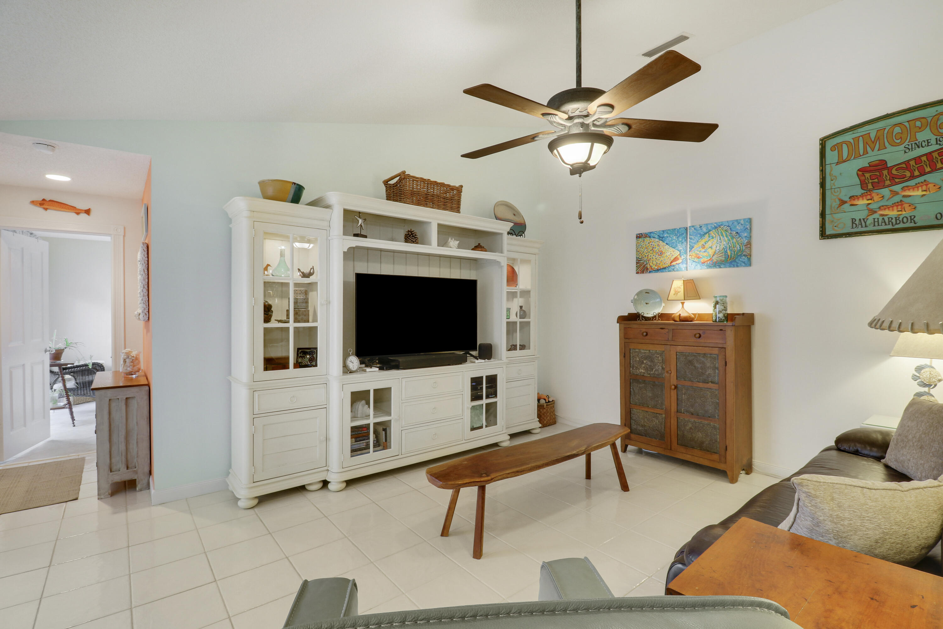 Pride of ownership shines throughout this beautifully maintained 2-bedroom, 2-bath residence in the highly sought-after community of Sun Terrace at the Oaks in Palm Beach Gardens. Priced to sell and move-in ready, this exceptional home offers the perfect blend of comfort, quality, and convenience. Thoughtfully updated with timeless finishes, the home features a beautifully renovated kitchen with granite countertops, tile backsplash, refaced cabinetry with soft-close drawers and doors, custom built-ins, filtered drinking water, and abundant storage. The spacious living areas are enhanced by custom millwork, a built-in buffet with butcher block countertop, and an inviting open floor plan ideal for entertaining or relaxing. The private primary suite features an updated bath with a beautifully re-tiled shower, frameless glass doors, and modern finishes. The guest bedroom offers extensive custom cabinetry and workspace, making it ideal for guests, a home office, or creative studio. Recent improvements provide peace of mind, including a new HVAC system (2022) with REME HALO whole-home air purification, a new water heater (2022), new glass-top range (2026), newer appliances, hurricane-impact features, accordion shutters, and wind mitigation upgrades that may help reduce insurance costs. Step outside to your resurfaced private patio with a ceiling fan - an inviting outdoor retreat perfect for morning coffee, afternoon reading, or evenings with friends. Beyond the home, you'll love the lifestyle that Sun Terrace at the Oaks offers. Residents enjoy a heated community pool, on-site professional management, basic cable, beautifully maintained grounds, and a welcoming neighborhood atmosphere. Outdoor enthusiasts will appreciate being able to walk to Oaks Park, featuring tennis courts, the Heart Trail, and covered picnic areas. Also within walking distance are the beautifully renovated Palm Beach Gardens Public Library and Palm Beach State College's Eissey Campus Theatre, offering year-round cultural performances and entertainment. Shopping and dining are just minutes away. The Gardens Mall, featuring Nordstrom, Saks Fifth Avenue, Macy's, and premier retailers, is only a five-minute drive. Legacy Place, Downtown at the Gardens, waterfront restaurants along the Intracoastal, Trader Joe's, Whole Foods, Publix, Plum Market, Doris Italian Market, Carmine's Market, Marshalls, and TJ Maxx are all conveniently nearby. Healthcare is equally convenient, with Palm Beach Gardens Medical Center-recognized as one of the area's premier cardiac hospitals-and numerous medical specialists located just one mile away. When it's time to enjoy the coast, the pristine beaches and iconic Juno Beach Pier are only 12 to 15 minutes from your front door. Commuters will appreciate quick access to Interstate 95 (1 mile), the Florida Turnpike (4.5 miles), and Palm Beach International Airport, just 20 minutes away. Offering exceptional updates, a prime location, outstanding community amenities, and an unbeatable Palm Beach Gardens lifestyle, 10301 Chapman Oak Court is ready to welcome you home. NOTE: Poly pipe replacement begins July 6.