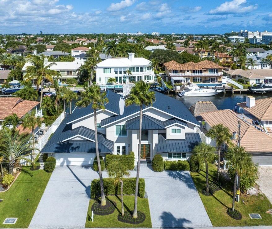 Welcome to your dream oasis in Tropic Isles, Delray Beach!  This stunning and completely renovated home offers 4 bedroom, 4 full bath on 90ft of waterfront on a wide canal with direct access. Some features include a brand new roof, a temperature controlled wine room, a custom kitchen with subzero and Viking appliances, a beautiful outdoor kitchen for entertaining, new a/c, new window treatments, fencing around dock and so much more. You do not want to miss this opportunity on this Turnkey home!