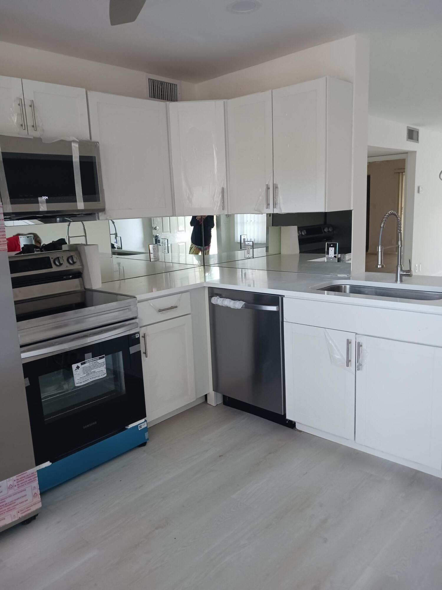 2/2 third floor LAKEVIEW, NEW KITCHEN WITH ALL NEW APPLIANCES, NEW NEUTRAL DELUXE  VINYL WATERPROOF FLOORING THRUOUT, NEW A/C, NEW WATER HEATER, NEW ELECTRIC BOX, NEW FRONT DOOR, HURRICANE SHUTTERS ON THE PATIO, WIDE OPEN VERY SPACIOUS LAYOUT. You can show this to your fussiest buyer, i think they will love it  easy to show -vacant