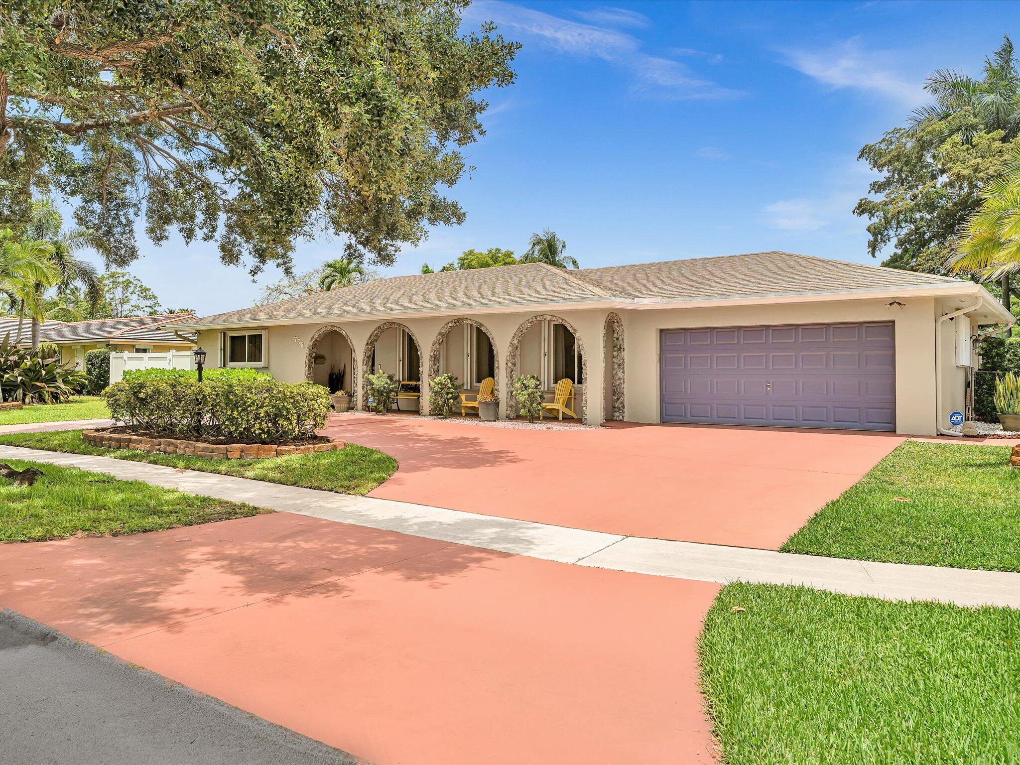 Royal Palm Estates 4 Bedroom 2 Bath Pool Home proves it is possible to be in the heart of Plantation and leave it all behind as you pull in your circular drive. Situated on 1/3 Acre Corner lot on a tree-lined, sidewalk street you'll find it hard to believe you're minutes from University and 595. Commuter's dream, and a peaceful haven for the days you can spend right at home. Entertaining family and friends, inside or out, is sure to be a regular occurence. Beyond the screened patio and pool remains a sprawling fenced yard filled with various fruit trees. Flowing floor plan includes a Primary Suite with large walk in closet and en suite bath and 3 generously sized guest rooms. Living area functions for quiet nights on the couch or a house full! It is your turn to make memories here. No HOA! DETAILS   Home has been pre-listing inspected.  2025 Sub-Panel  2024 AC 2021Tankless Water Heater 2018 Roof Copper and PVC Pipes   One bedroom is not pictured, used as a well kept owner's retreat.  Decorative Fireplace Does not convey to Buyers.  Mango, Banana and Ackee Trees in yard, some  potted plants may remain at Buyer's request.  Sprinklers on well, keeping the grass green and the water bill low!   Full Storm Protection with combined Impact & Accordion