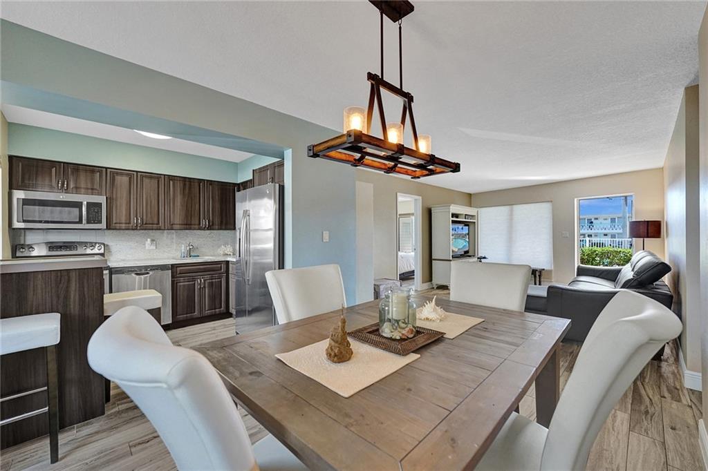 Waterfront Condo in Coral Ridge Country Club Estates!  Two-Bedroom/2 Bath Unit with updated floors, kitchen and bathrooms located just east of Bayview Drive!  Dockage available thru the Association. No fixed bridges!  Only 12-Units in the complex.  No leasing for first 24 months of ownership.  Sorry No pets.