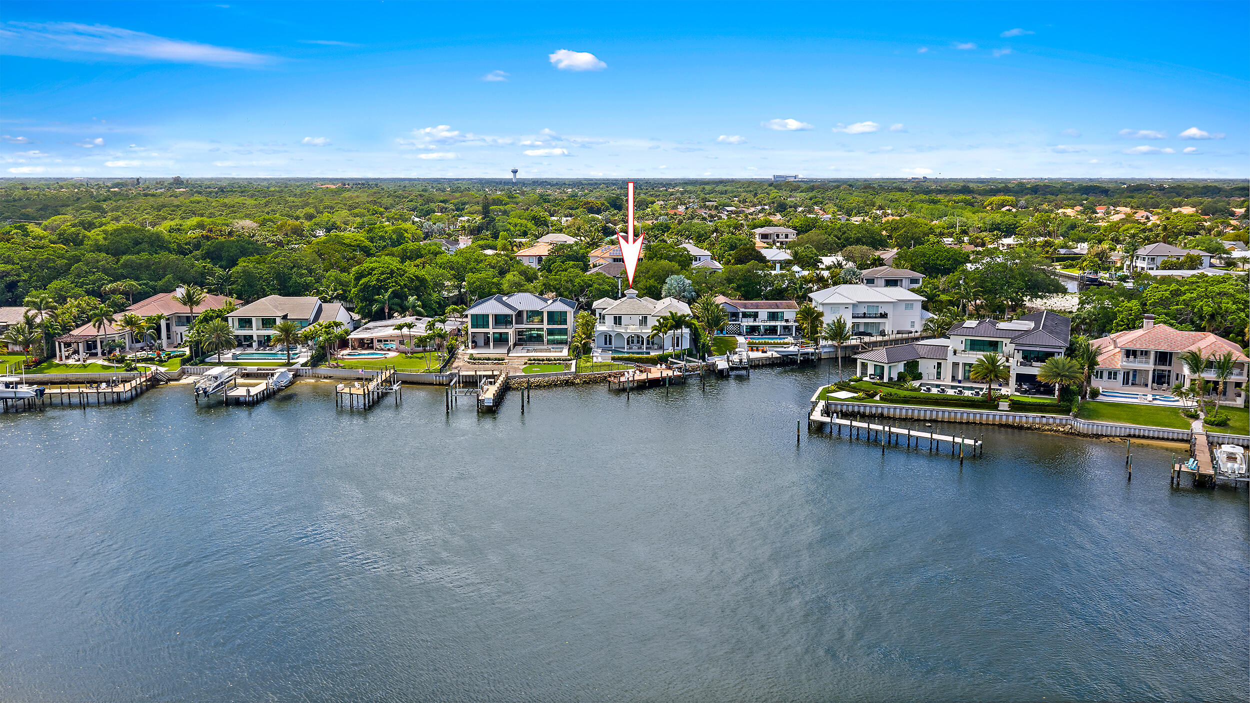 Experience premier Intracoastal living, this property offers wide water views, no fixed bridges and hard-to-find dockage accommodating multiple deep-water vessels, including a sportfish yacht and center console. Set within a no-wake zone and featuring direct ocean access just minutes from Palm Beach Inlet, this home is a dream for boating and waterfront enthusiasts.  Coveted eastern exposure delivers stunning sunrises and cool afternoons. Meticulously maintained and thoughtfully updated, including new hardscaping, landscaping and a new roof with copper detailing. Interior highlights include soaring ceilings, five ensuite bedrooms, private office with water views, and a 3-car garage with lifts-ideal for collectors. Close to world-class golf, dining, and the best of the Palm Beach lifestyle.