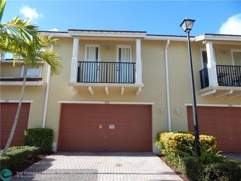 Beautiful lakefront townhouse located in the desirable gated community of Coconut Creek! This spacious 3-bedroom, 2.5-bath home offers 1,450 sq ft of comfortable living space, complete with a 2-car garage. Enjoy serene water views right from your backyard, perfect for relaxing or entertaining. The home features a modern kitchen with elegant granite countertops, along with durable vinyl flooring throughout the upstairs bedrooms and bathrooms. The well-designed layout provides both functionality and style, ideal for families or buyers seeking low-maintenance living. Residents of this community enjoy access to a refreshing pool and the security of a gated condominium. Conveniently located near shopping, dining, and major highways. The HOA includes, water, internet, cable tv, roof reserves. Tenants will vacate the property upon of the sale.