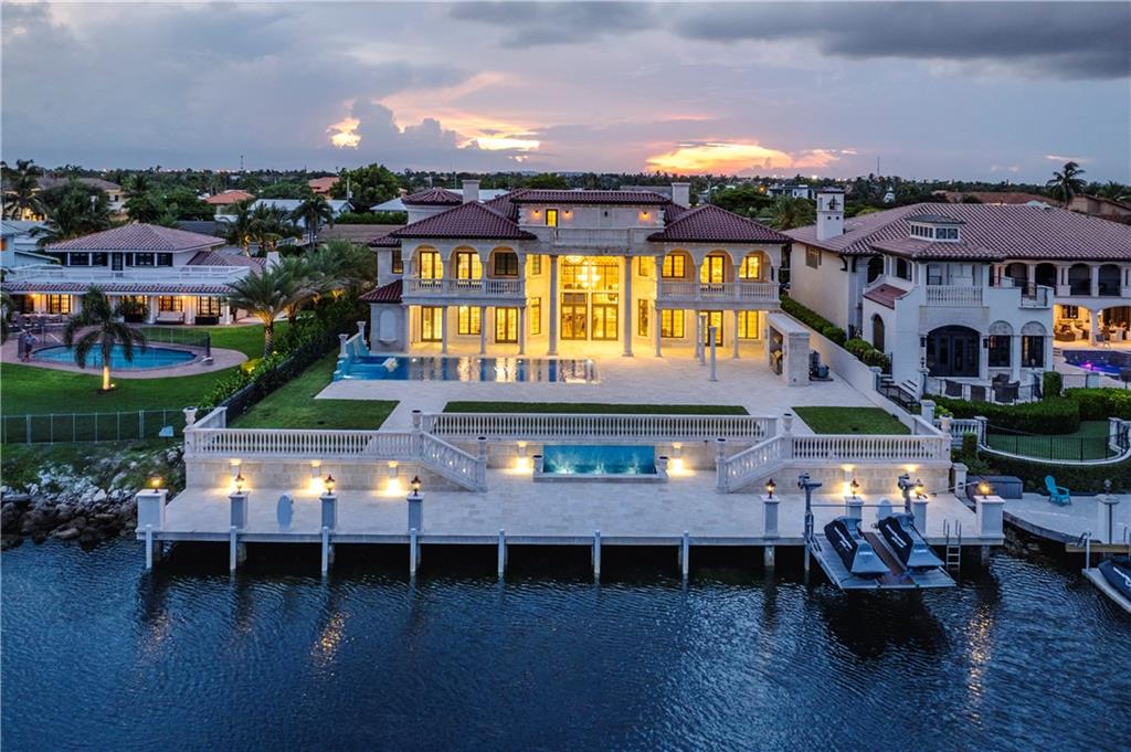 Waterfront Palace in Lighthouse Point! This 7 bed, 9 bath mansion with a 100ft deck will take your breath away. A modern interpretation of the classic European style, inspired by the Hermitage Museum of St. Petersburg. Hand-cut Jerusalem marble covers the entire outside, hand-carved marble pillars, & stunning views. Inside walls & ceilings made with Venetian plaster, applied by hand by the late Gregory Slyuta. Stunning hand-assembled stained glass & imported marble floors. Chandeliers & sconces with embedded Swarovski Crystals & 24-carat gold leaf in every room. Control4 audio-visual system & Light system, Lochinvar water heater, NuTone central vacuum, A wine room, multiple wet bars, top-of-the-line appliances & equipment, and Phylrich fixtures. Excellent location, this home is a must-see!