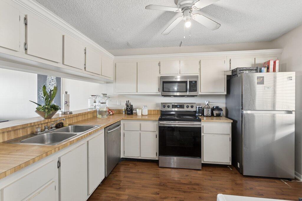This spacious 2-bedroom, 2-bath condo is located within a secure, all-ages community and offers comfortable living on the fourth floor. The bright and open layout creates a welcoming atmosphere with great natural light and an easy flow throughout the home. The kitchen features stainless steel appliances, including a dishwasher and range, offering both style and everyday functionality. An in-unit washer and dryer adds everyday convenience. Enjoy access to resort-style amenities, including two swimming pools, a tennis court, and a clubhouse, perfect for relaxation and recreation. The property also includes a dedicated parking space and additional storage for practical use.  Well-positioned within a desirable community, this condo combines comfort, convenience, and access to excellent amenities. Schedule your private showing today.