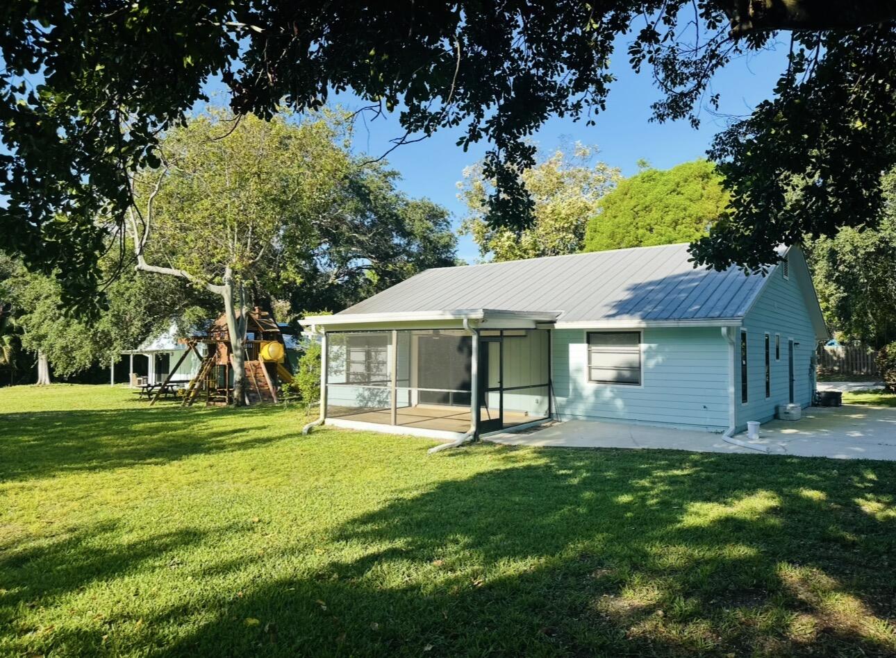 Set on an exceptionally rare .71-acre near-perfect square lot, this distinguished private estate presents a fully renovated 2/2, 1,539 SF main residence alongside an impeccably updated 640 SF guest home—two pristine single-family dwellings offering extraordinary versatility. Backing to a tranquil natural preserve, the property delivers unmatched privacy on a true jumbo-sized lot, creating a secluded sanctuary just minutes from Jupiter's finest beaches, championship golf, premier boating, upscale dining, and boutique shopping. Whether envisioned as two high-performing luxury rental homes, exclusive dual Airbnbs, or effortlessly transformed into a bespoke dream estate, this offering adapts seamlessly to your lifestyle or investment goals. In under a 10-minute drive, your feet can be in the sand at Coral Cove Park, completing a truly rare opportunity to own a private, multi-residence estate in one of Jupiter's most coveted coastal enclaves.