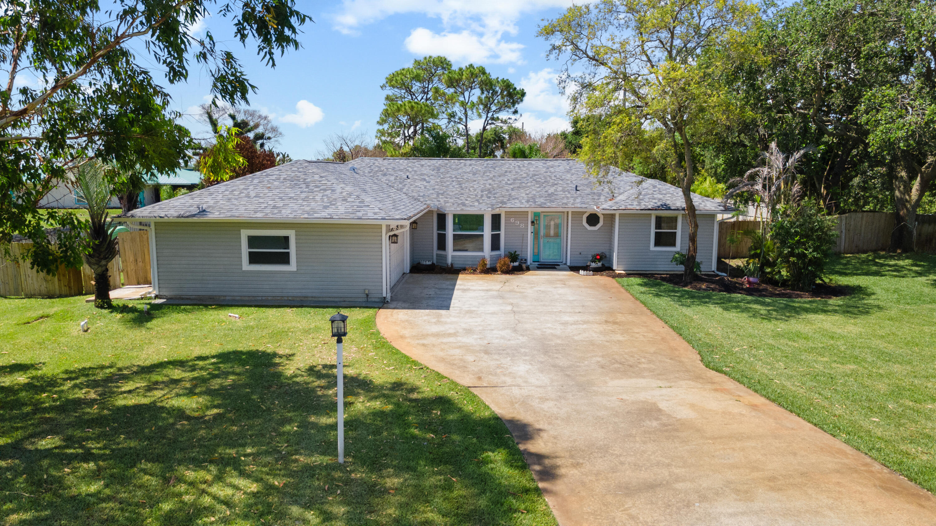 Only 40 homes in this community with low HOA! 2020 Roof + A/C. on 0.58 Acre lot with saltwater pool, flagstone paver patio, screened in porch & a fenced in yard with plenty of additional upgrades! Popular open/split floor plan. Kitchen w/breakfast nook, SS appliances Quartz counters and soft close cabinetry. Both baths feature beautiful tile craftsmanship. Spacious primary suite with his & her closets, dual sink vanity, and walk-in shower. Super popular open/split floor plan. Large guest bedrooms with plenty of closet space. Property features peach, mango, avocado and start fruit trees! located within 3 miles of day to day shopping, restaurants, boat ramps and intracoastal.