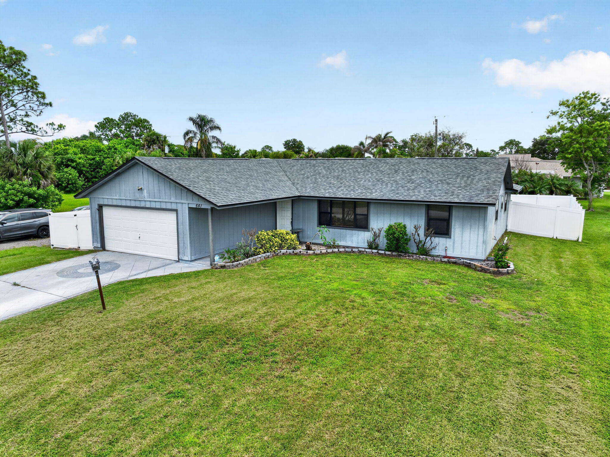 Great starter home in the heart of Port St. Lucie close to everything.  3-bedroom 2-bath with covered screen lanai, white vinyl fence, open patio, and storage shed.  Newer AC and one year old roof.  Kitchen has all appliances and skylight, cathedral ceilings and 2 car garage.  Wood flooring except in bedrooms.  Fantastic home to raise a family and to add your personal touches.  Quiet neighborhood great for kids.