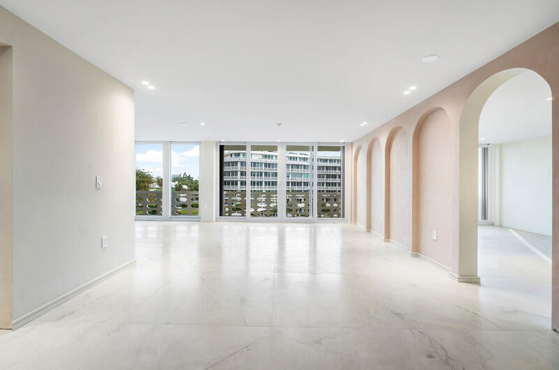 Impeccably renovated one-bedroom plus den, two-bath residence convertible to a two-bedroom, offering bright modern sophistication throughout. Fully gutted with new plumbing and electrical, featuring 48" x 48" porcelain tile floors, custom doors with premium brass hardware, and embedded high-hat lighting. Gourmet kitchen showcases Poliform Italian cabinetry, Sub-Zero refrigerator, and Wolf appliances. Luxurious baths feature Cristallo quartzite, custom wood vanities, and brass fixtures. Elegant interiors include sculptural furnishings, arched niches, and stunning city views. Serene primary suite with velvet accents, DAN convertible pocket door, and expansive Poliform walk-in closet with illuminated bespoke cabinetry.
