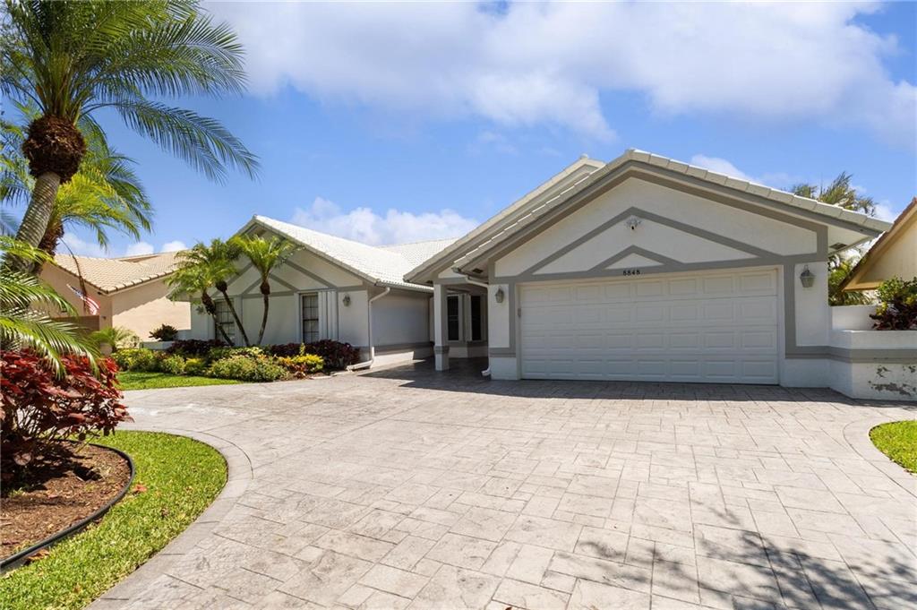 A stunning and rarely availabe waterfront home in the highly sought after community of Pine Ridge.  This is a completely remodeled custom turnkey home! Buyers just move right in!! Huge open floor plan home that flows from end to end.  New Dual Air conditioning system, New Propane Generac system, Upgraded Electrical panels, Custom Epoxy Garage, Refinished Heated Pool with outdoor shower, Stainless steel Samsung Appliances, Custom Walk in Closets, Alarm, and Accordion Shutters.  Come see this home and it's one of a kind beauty before it's gone.