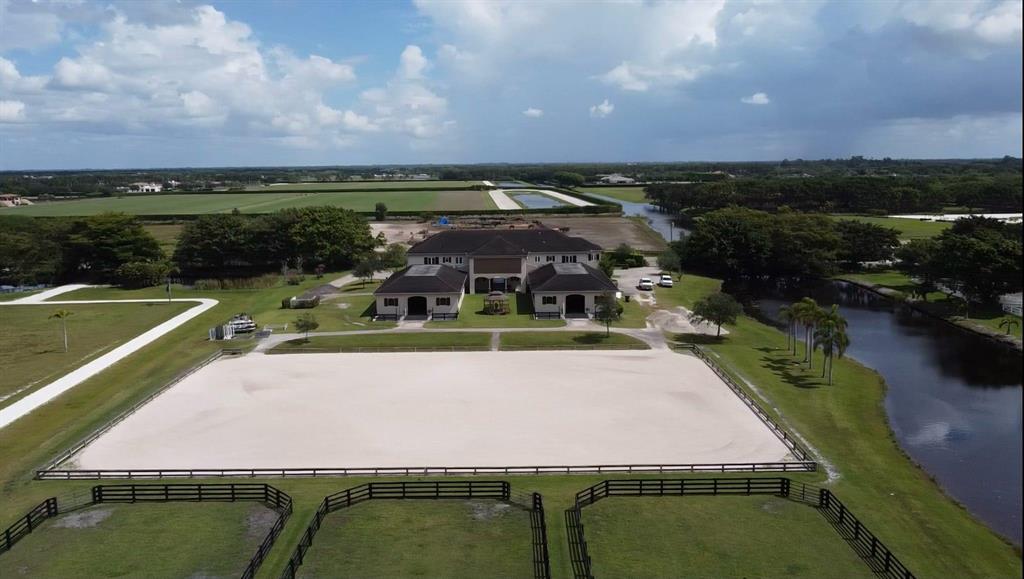 24 stall barn, 3 bedroom grooms quarters, 7 bedroom owners house, 5 acres, ring, paddocks, walker.