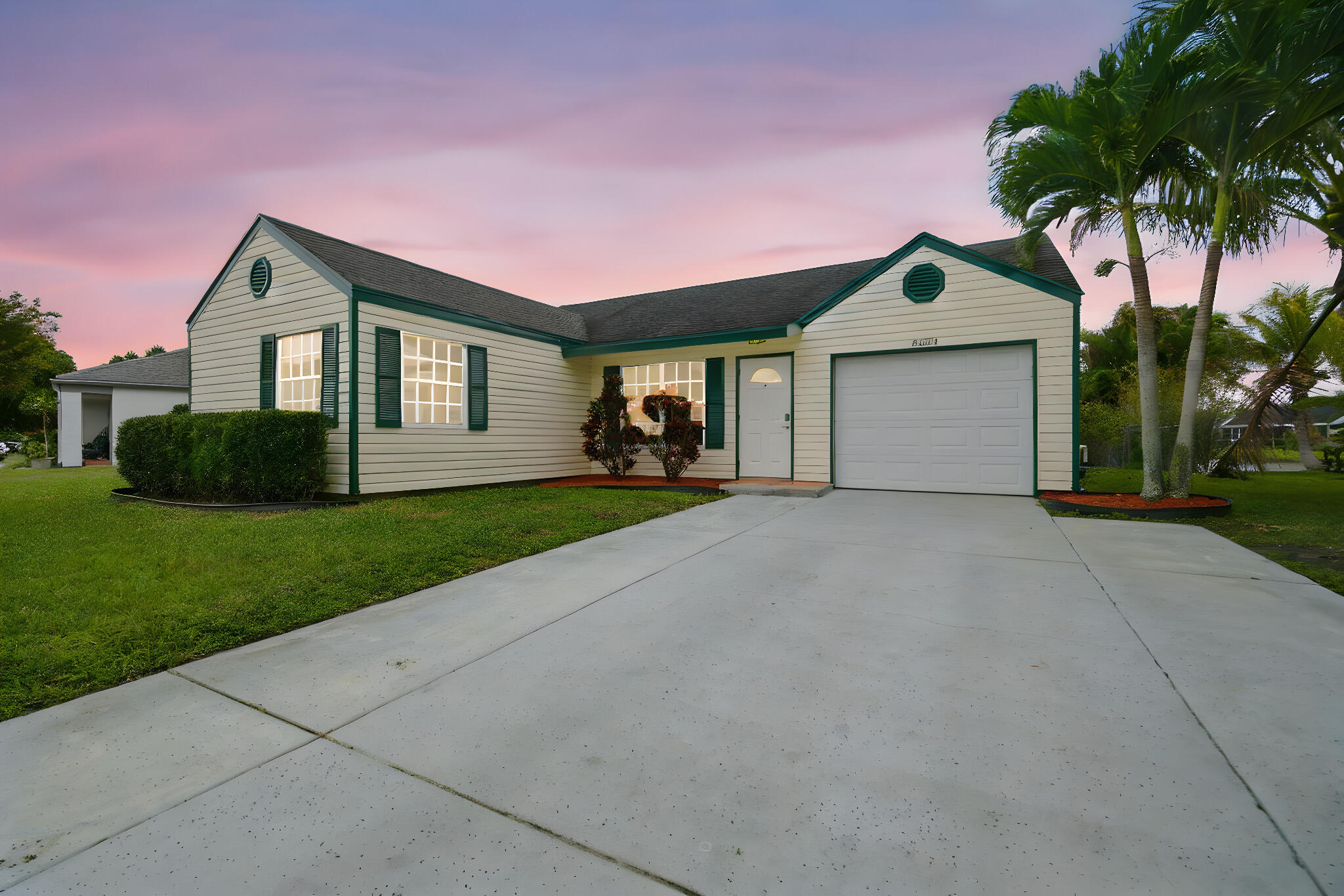 Rarely available, fully renovated lakefront home in the highly sought-after Waterchase West community, located in the heart of Boynton Beach and within top-rated A+ school zones.  Enjoy stunning lake views while soaking up the South Florida sunshine from your screened-in patio, overlooking beautifully manicured landscaping. Situated on a premium interior lakefront pie-shaped oversized lot, this property offers exceptional privacy, is fully fenced, and has ample space to add a pool. Inside, you'll find tile and rich chestnut laminate flooring throughout—no carpet anywhere. The home features a modern, neutral design with stylish finishes, granite countertops, and stainless steel appliances. Major updates include an updated water heater (2018), A/C system (2012), roof, & lake-fed irrigation system. Waterchase West offers low HOA fees that include cable, along with a beautifully maintained community pool just steps from your door. This move-in-ready lakefront gem truly has it all—location, upgrades, and lifestyle. Welcome home!