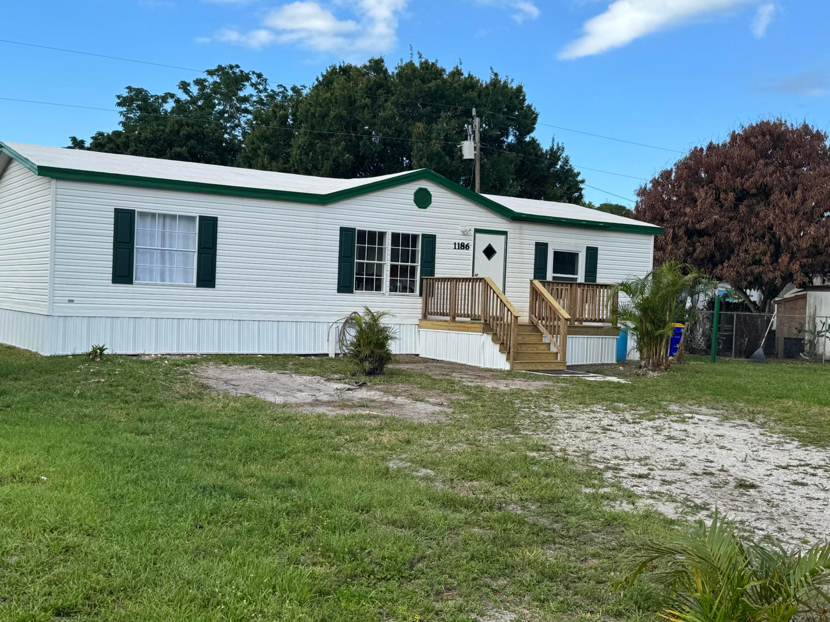 3 bedroom, 2 bath manufactured home built in 1998. Seller has updated the property including but not limited to brand new central A/C system, front entry stairs, interior paint, some light fixtures, kitchen sink & faucet, exterior skirting, waterproof roof coating and more. Split bedroom plan, roman tub with separate shower in primary bathroom, inside laundry room, cathedral ceilings. Storage shed. Water filtration system. YOU OWN THE 75' X 100' LOT. No HOA! Easy access to I-95.  This affordable home is expected to sell quickly.  Mortgage financing available. Possible seller financing. Septic system was pumped out 05/2026. Water heater 2022.