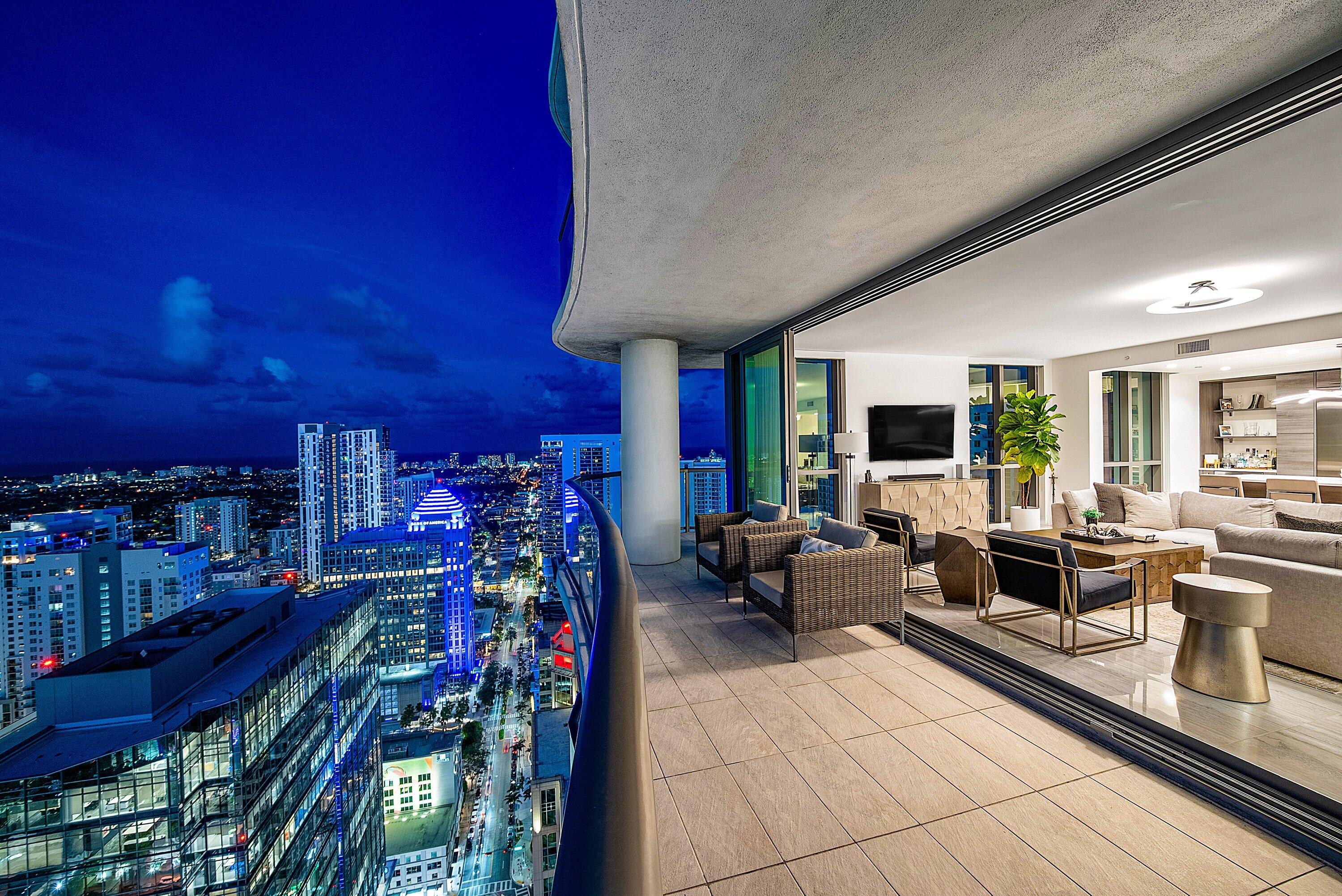 Welcome to Sky-House on Las Olas: Over 3800 sqft of elevated living above Fort Lauderdale. Perched on the 43rd floor of the tallest downtown condo, this double-unit showcases panoramic views from the cityscape to the ocean. With 3 ensuite bedrooms, a 4th for your office, & 4.5 baths, this unit is thoughtfully designed for comfort & sophistication. The chef's kitchen features JennAir appliances, quartz countertops, & a seamless open-concept that flows into living & dining areas with unobstructed views. Watch the sunrise over the ocean from the primary suite balcony & unwind in the evening on the wrap-around as the sun sets over the city. With the Las Olas lifestyle just outside your door, dine at world-renowned restaurants & local hidden gems or check out the market in Huizenga Park.