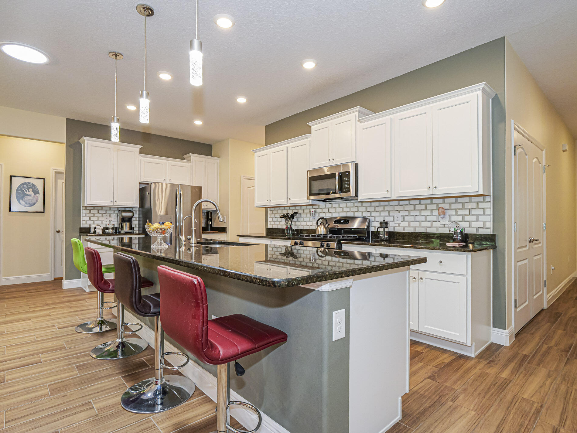 Come see this beautiful Marquesas model located in the most prestigious 55+ community in Vero Beach. This wonderful 3/2 with a large den home features all impact windows, chef's kitchen with a large island, water softener system, great room, extended screened patio with preserve views, wood like plank tile throughout the house, luxurious primary bath, natural gas, extended garage and so much more. Resort style clubhouse features fitness center, pool, pickleball, and game rooms. Low HOA includes all lawn care. This is Florida living at its best.