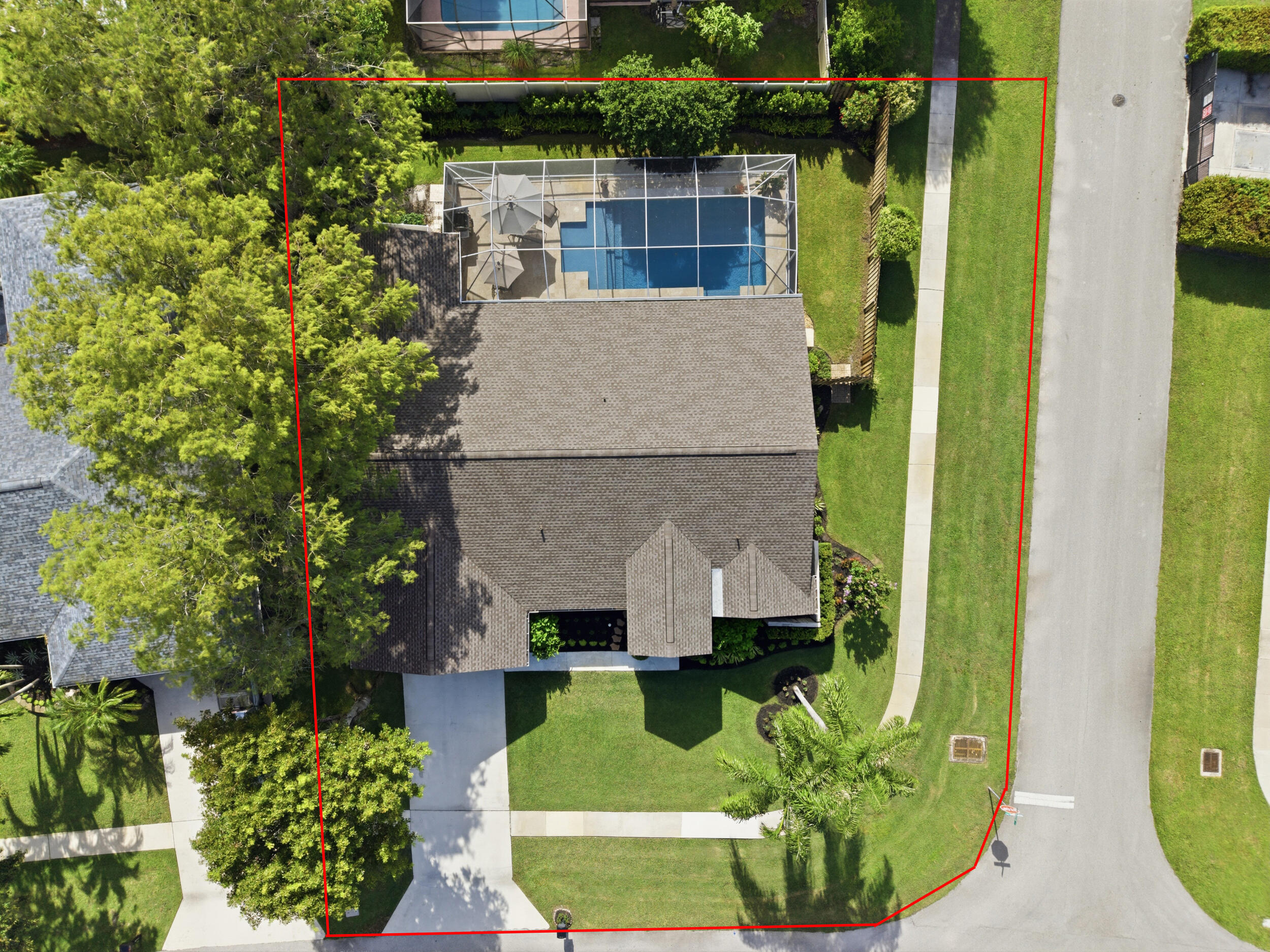 Welcome to this beautifully updated and meticulously maintained 3-bedroom, 2-bathroom pool home featuring a desirable split floor plan, a versatile den that can easily be converted into a 4th bedroom, and a spacious 2-car garage. Perfectly positioned on a corner lot in a desirable no-HOA community within a top-rated school district, this residence offers the ideal blend of comfort, style, and convenience. From the moment you arrive, you'll be captivated by the home's impeccable curb appeal, highlighted by lush, professionally manicured landscaping and a level of pride of ownership that is evident at every turn. Thoughtfully curated with exceptional upgrades, this home features a new roof (2024) with a transferable warranty, impact-rated windows and doors (installed in 2019 and 2021),  rich engineered hardwood flooring throughout, a fully redesigned and remodeled pool (2021), a beautifully updated kitchen, and thoughtfully selected lighting and fixtures that enhance the home's timeless appeal. Step inside through the grand impact French entry doors into an impressive foyer where soaring cathedral vaulted ceilings, elegant trim work, and gorgeous engineered hardwood floors immediately set the tone. Just off the foyer is a spacious den, ideal as a home office, playroom, or additional living bedroom, featuring recessed lighting, updated fixtures, and impact French doors leading directly to the patio. Also off the grand foyer, an elegant formal dining room welcomes you with rich hardwood flooring, a stunning decorative fireplace, abundant natural light, and a statement chandelier that creates a sophisticated setting for both intimate dinners and lavish entertaining. The kitchen is truly a chef's dream, boasting solid wood shaker-style cabinetry with crown molding, sparkling granite countertops with ample prep space and bar top seating, a designer tile backsplash, dual sink with disposal and updated hardware, wine refrigerator, recessed lighting, and an updated fixture. Adjacent to the kitchen is a charming breakfast nook complete with a built-in storage bench and three impact windows that fill the space with natural light while overlooking the pool. The kitchen flows seamlessly to the spacious living room featuring soaring vaulted ceilings, recessed lighting, an updated light fixture, and two sets of impact French doors that create the perfect indoor-outdoor flow to the screened pool area. A dedicated laundry room offers additional convenience with built-in cabinetry, shelving, and a utility sink. The spacious primary suite serves as a private retreat with cathedral vaulted ceilings, abundant natural light, an updated ceiling fixture, impact French doors leading to the screened patio and pool, and a large walk-in closet complete with custom built-ins. The luxurious primary bathroom features an oversized solid wood dual-sink vanity, updated lighting, a relaxing soaking tub, and a fully tiled walk-in shower with a built-in bench and frameless glass enclosure. Both secondary bedrooms are generously sized with ample closet space and updated fixtures. One bedroom also features impact French doors providing direct access to the pool area. The updated guest bathroom includes a solid wood vanity topped with granite, updated lighting, and a fully tiled tub/shower combination complete with niche shelving and modern hardware. Step outside to your own private backyard oasis. The fully screened pool area showcases beautiful travertine decking surrounding a completely remodeled heated saltwater pool featuring a sun shelf, spa bench with therapeutic jets, waterfall feature, multicolor LED lighting, and a fully automated control system that can be operated directly from your smartphone. The covered patio provides an ideal space for year-round outdoor dining and entertaining with retractable shades for added comfort. The fully fenced backyard offers exceptional privacy and is beautifully landscaped, creating the perfect setting to relax or host family and friends. One of this home's standout features is its prime Wellington location. Situated within an excellent school district, the property is just minutes from highly rated schools, everyday shopping, dining, and entertainment, including The Mall at Wellington Green and the surrounding retail centers. Residents also enjoy convenient access to numerous parks, walking trails, playgrounds, athletic facilities, and Wellington's renowned equestrian venues, making it easy to embrace the area's active lifestyle. Commuting is a breeze with quick access to Forest Hill Boulevard, Southern Boulevard, and Florida's Turnpike, while beautiful Palm Beach County beaches and downtown West Palm Beach are just a short drive away.