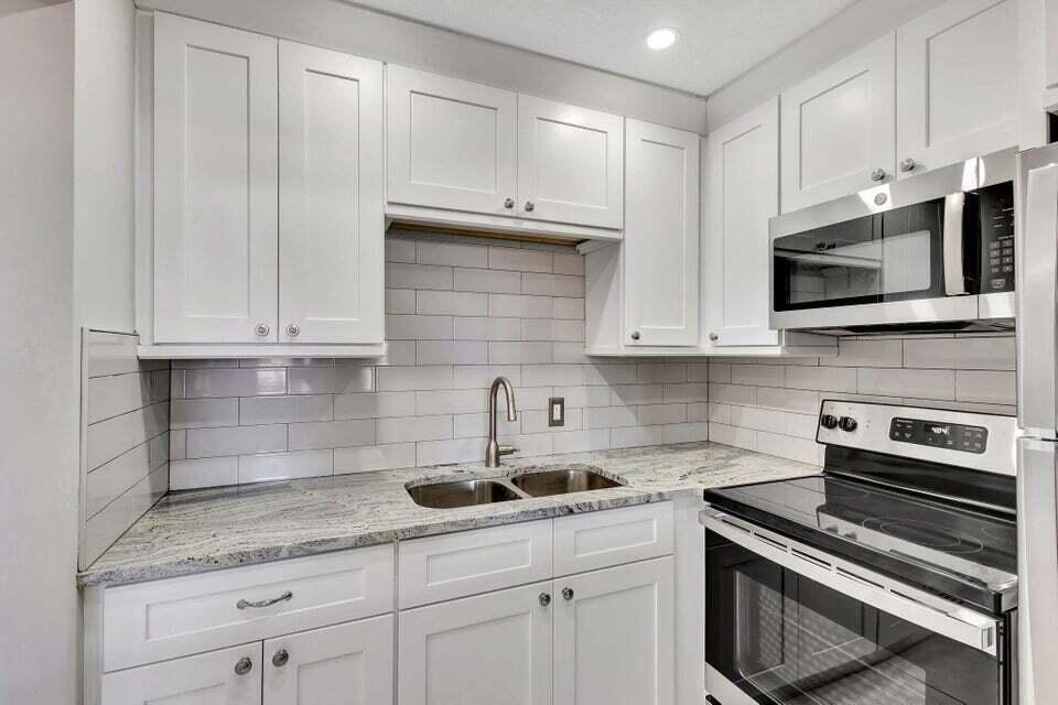 Beautifully remodeled ground floor unit in a gated 55 + community. This move in ready condo features a brand new kitchen with solid wood, soft close cabinetry, stainless steel GE appliances, and stunning granite countertops. The ceilings have been updated with smooth knockdown texture (no popcorn) and the bathroom includes a new hardwood vanity with granite top & Moen fixtures. Featuring a safe walk in shower. Enjoy peaceful water views from your private patio. Rarely available ground floor unit. Don't miss this opportunity to live in this sought after active adult community next to the Camden pool with a great Association and friendly neighbors. Just take one look and you will see the difference.