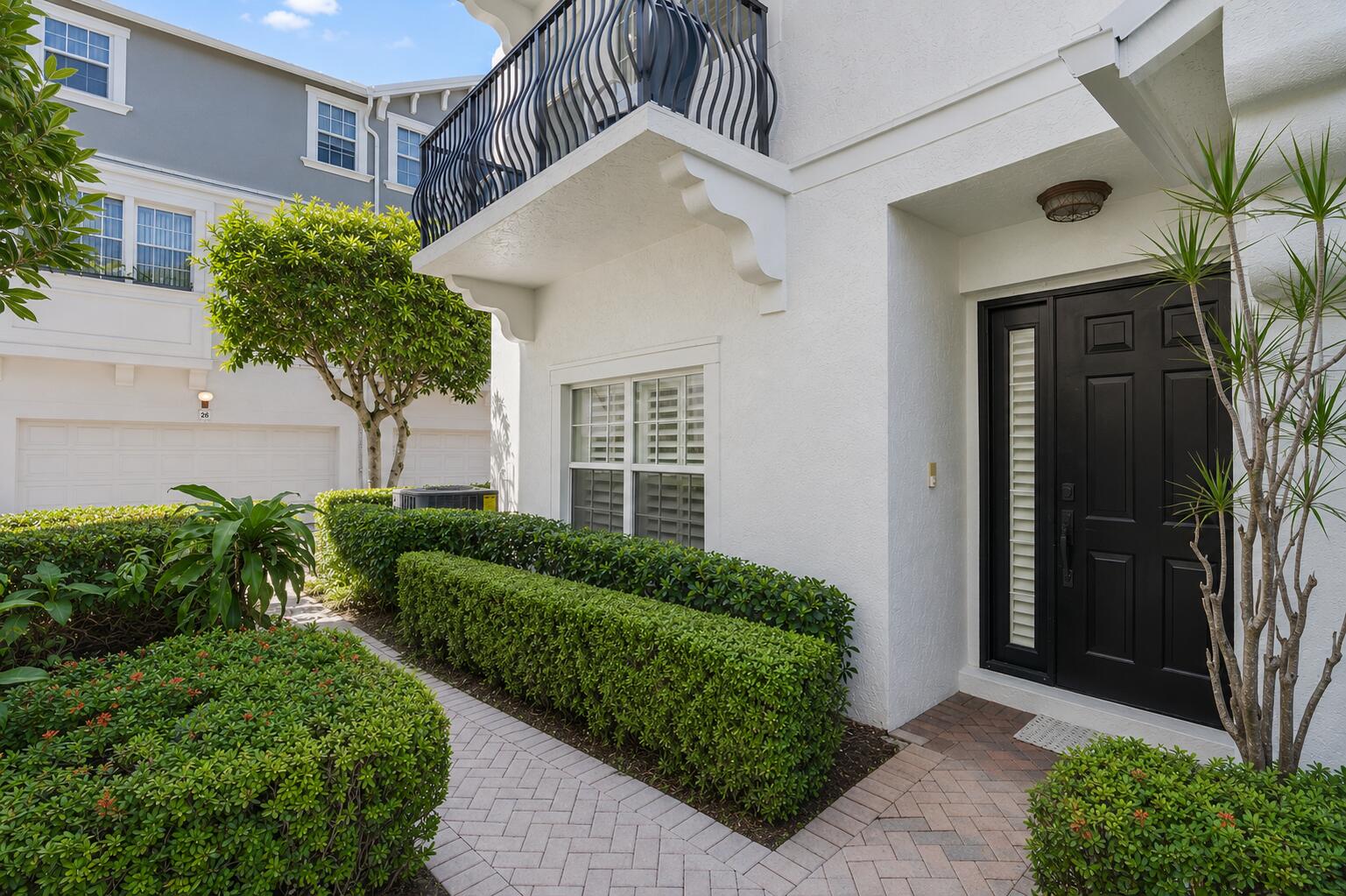 Desirable DOWNTOWN location, 2 blocks from Pineapple Grove & 3 blocks from Atlantic Ave. Spacious interior, corner unit, 3-story townhouse with second-floor balcony. New white quartz countertop & backsplash. Hurricane impact windows & doors. Custom plantation shutters. Porcelain wood plank tile floors. New lights & ceiling fans. 2-car garage. Epoxy paint on the garage floor. New glass shower & tub bathroom doors. Newer appliances - 2024 AC unit, range, microwave & washer, 2021 Refrigerator, 2019 Dishwasher, 2018 Dryer. San Sebastián Community: 2023 Gutters, 2022 Roof, Heated community pool, Low HOA, 1 of 32 townhouses