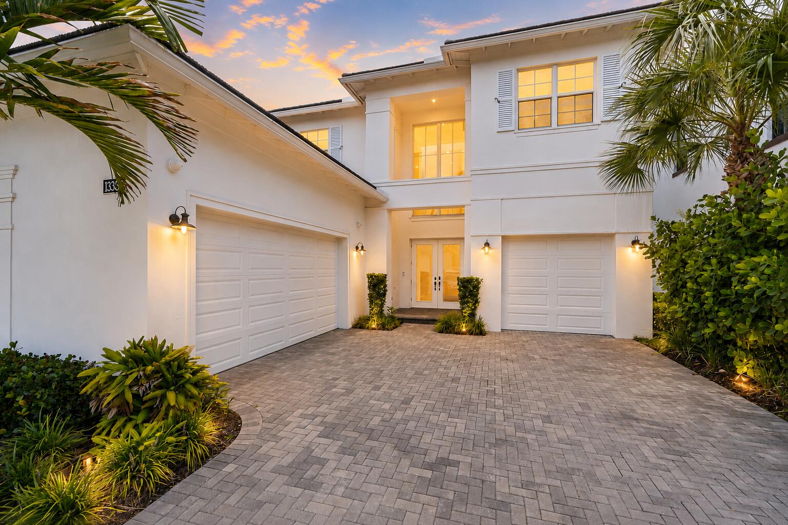 Completed in 2023, this 5-bedroom, 5.5-bath residence offers 5,109 square feet under air in one of Alton's largest floor plans, combining thoughtfully selected upgrades with a private preserve backdrop. A first-floor primary suite, expansive living spaces, upstairs bonus room with a wet bar, private pool and raised spa, and built-in grill create a home designed for both everyday living and effortless entertaining. From the moment you enter, the soaring two-story great room creates an immediate sense of space and natural light. Wide-plank flooring, board-and-batten detailing, and a custom wood-slat feature wall add warmth and character throughout the main living areas. Designed for gathering, the chef's kitchen features ceiling-height cabinetry, a dramatic island, gas cooktop beneath a statement hood, wall oven, dual refrigerators, walk-in pantry, and seamless connection to the dining and living spaces. A private office with custom built-ins and a separate media room provide flexibility for working from home, relaxing, or hosting guests. The first-floor primary suite serves as a private retreat with direct access to the pool, dual custom walk-in closets, and a spa-inspired bath featuring dual vanities, a freestanding soaking tub, and an oversized frameless shower finished in large-format tile. Upstairs, additional bedrooms offer walk-in closets and en-suite or nearby baths, while the spacious extra room includes a wet bar and opens to a covered balcony overlooking the landscaped preserve. Built with CBS construction, impact glass, and a concrete tile roof, the home offers the benefits of newer construction throughout. Outside, the backyard was designed for year-round Florida living, featuring a travertine pool deck, raised spa, covered lanai, built-in grill, and a fenced backyard with no rear neighbors beyond the preserve. Residents of Alton enjoy access to The Club at Alton with resort-style pools, fitness center, tennis, pickleball, dog parks, playgrounds, and miles of walking trails, all just minutes from Alton Town Center, PGA Boulevard, I-95, Downtown at the Gardens, Juno Beach, and Jupiter's coastline.