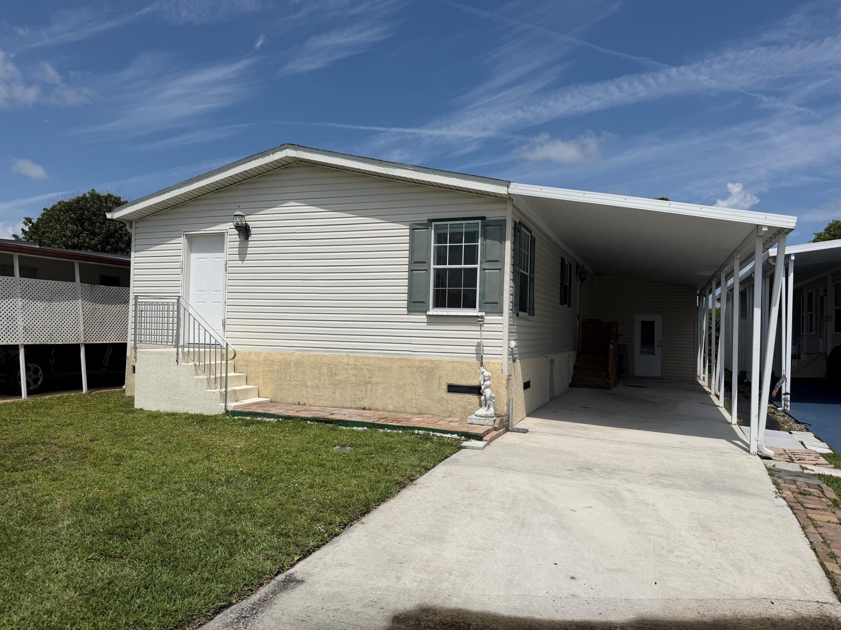 Beautiful 2/2 double wide built in 2010 with carport - two sheds - gorgeous wood laminate floors through out -open kitchen with Island - -washer and dryer could be moved inside as there are hookups in laundry area - - - - one of the larger homes available in Park City- financing available - -assoc. states it is HOPA verified - -priced right for quick sale - truly a must see........