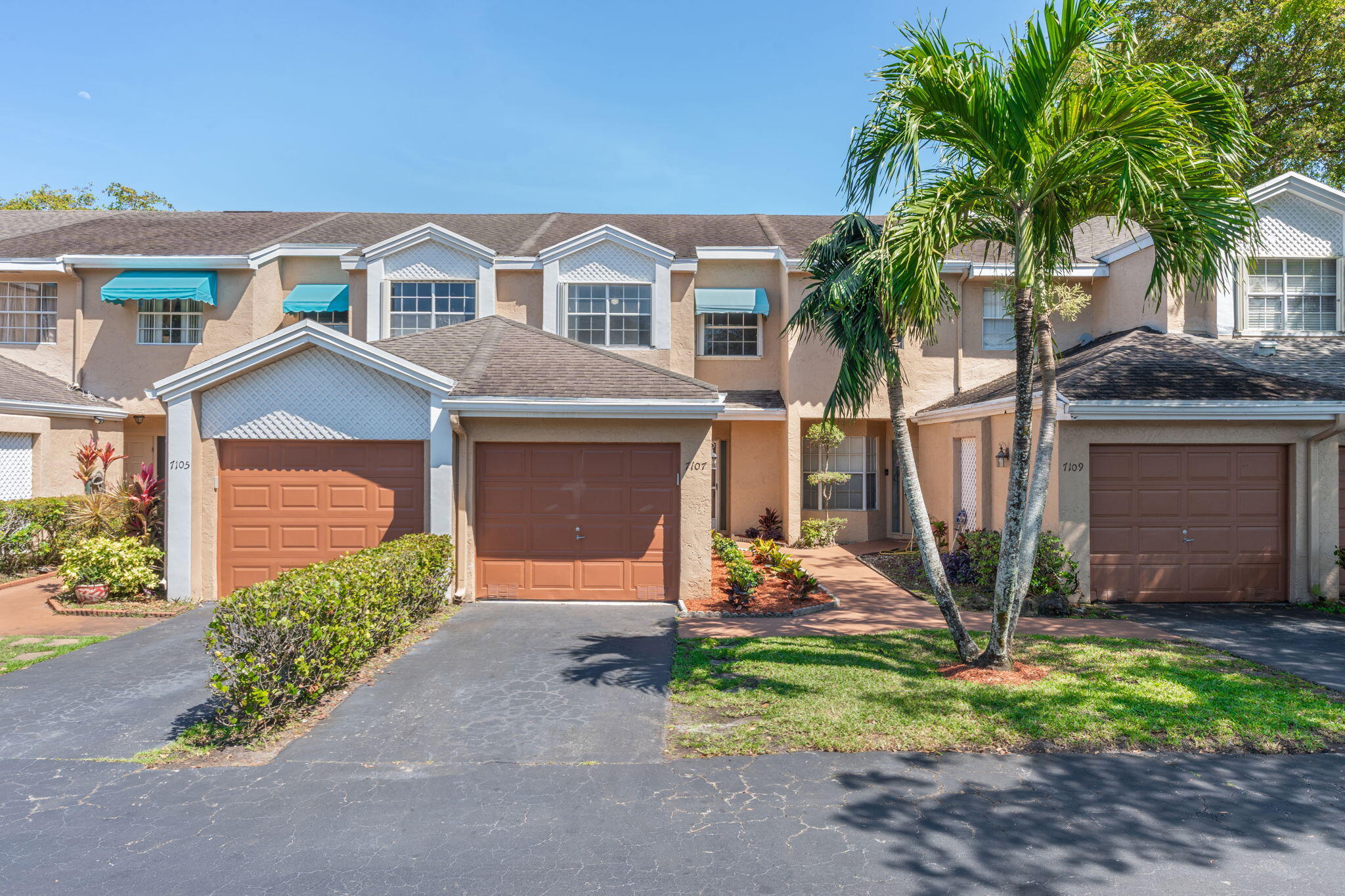 Spacious 2 Bed 2.5 Bath Townhome Featuring New Vinyl Flooring Throughout, Fresh Interior Paint, New Stainless Steel Appliances (Refrigerator & Range), New Lighting, Impact Rated Garage Door, Accordion Shutters and a Screened-in Patio. Located in the Desirable Community of Woodmont Featuring a Pool, Tennis Courts and Low HOA Fees. Pets are Welcome (no aggressive breeds). FHA Approved! Vacant and Easy to Show.