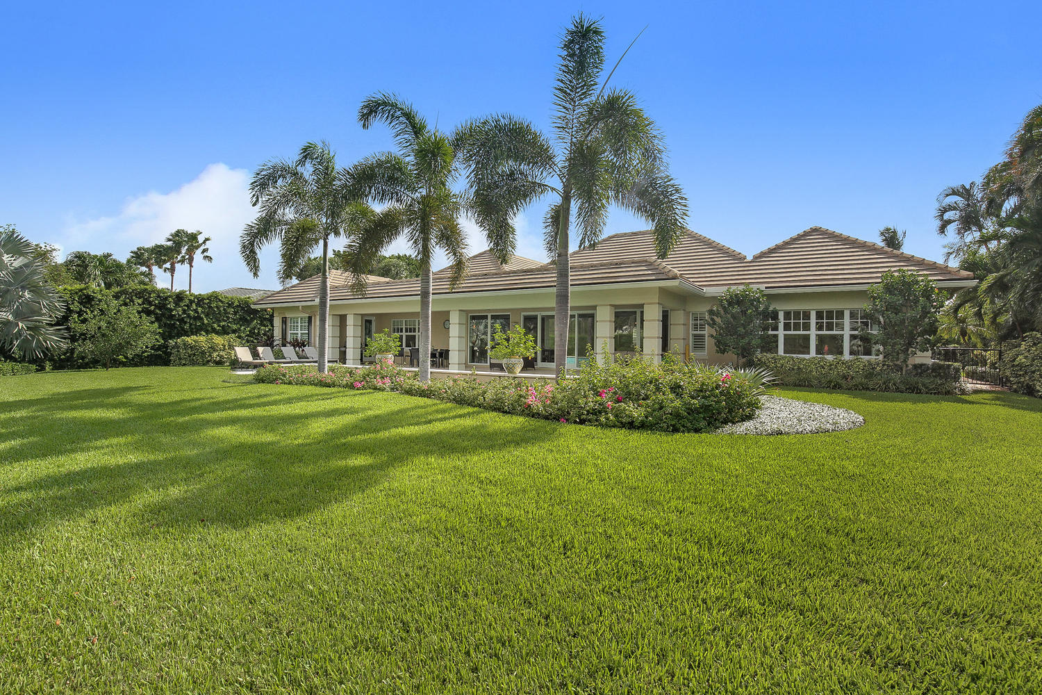 In mid-2013 the slab and studs were all that were remaining of the original home. Lavelle Construction worked their magic and the completed home exemplifies their exceptional workmanship. This 4 BR/4.5 BA home sits on a beautifully landscaped .42 acre lot. Wood floors throughout the entire home. Impact windows and doors. Plantation shutters. Quartz countertops in kitchen. The swimming pool was enlarged to include a ''sun shelf'' for chairs or small children, has three waterfall outlets and is a salt water pool. The garage is air conditioned. Home available ''As Is'' with furniture purchased in 2014.